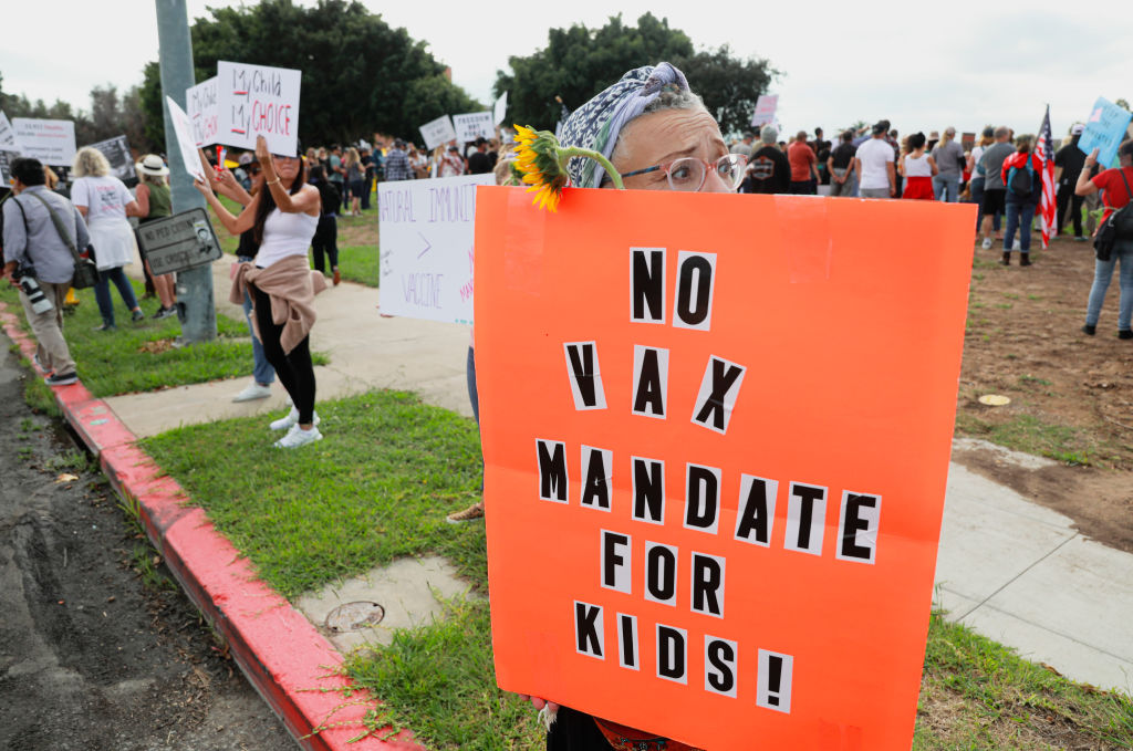 Demonstrators stage a protest outside of the San Diego Unified School District office to protest a vaccination mandate for students on Sept. 28, 2021 in San Diego, California. (Sandy Huffaker/Getty Images)