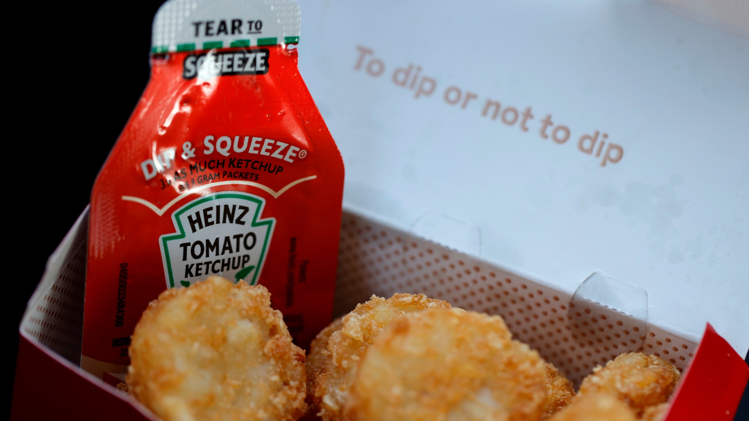 A packet of Heinz ketchup is displayed with Chick-fil-A hash browns on April 12, 2021, in Novato, California. (Justin Sullivan / Getty Images)