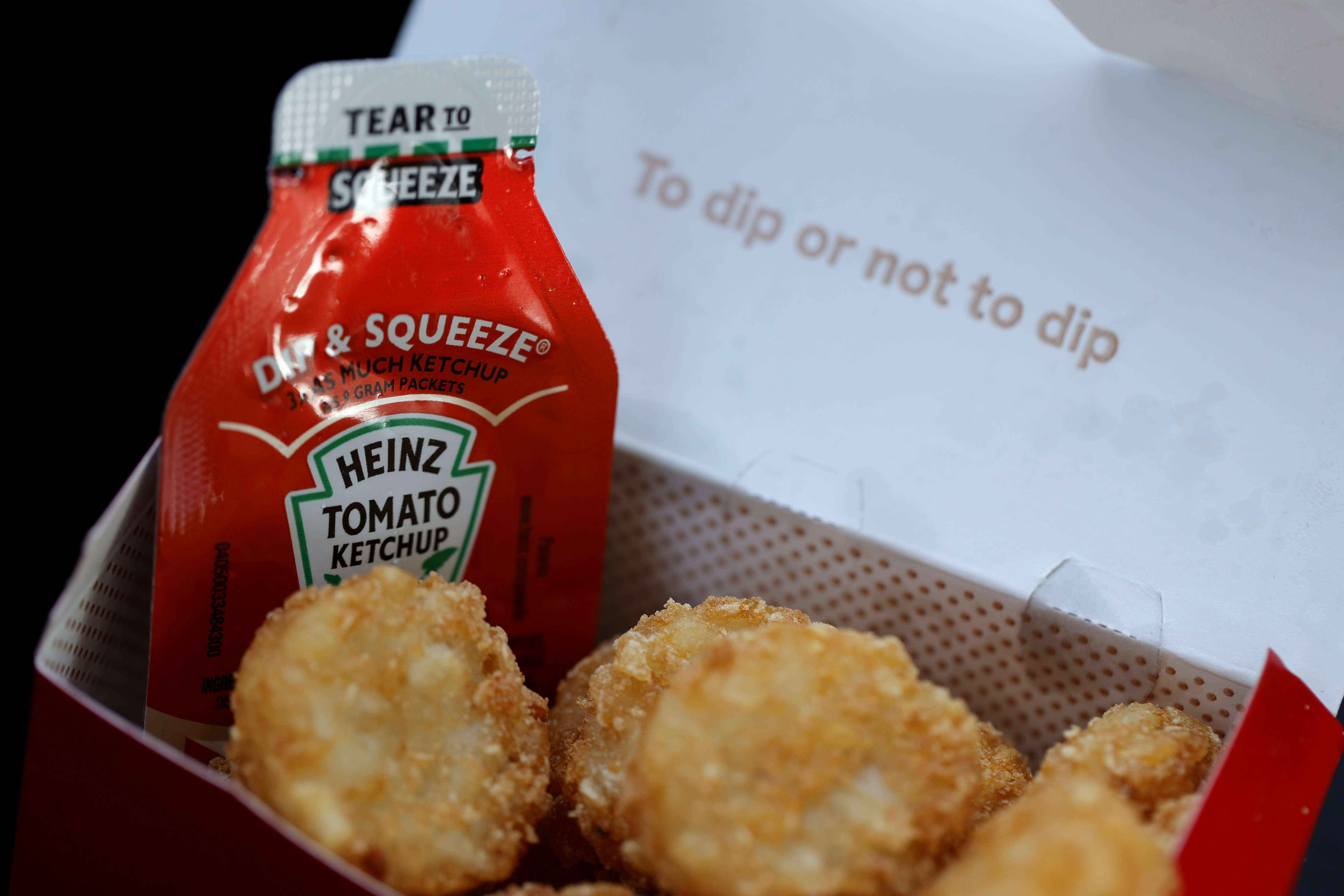 A packet of Heinz ketchup is displayed with Chick-fil-A hash browns on April 12, 2021, in Novato, California. (Justin Sullivan / Getty Images)