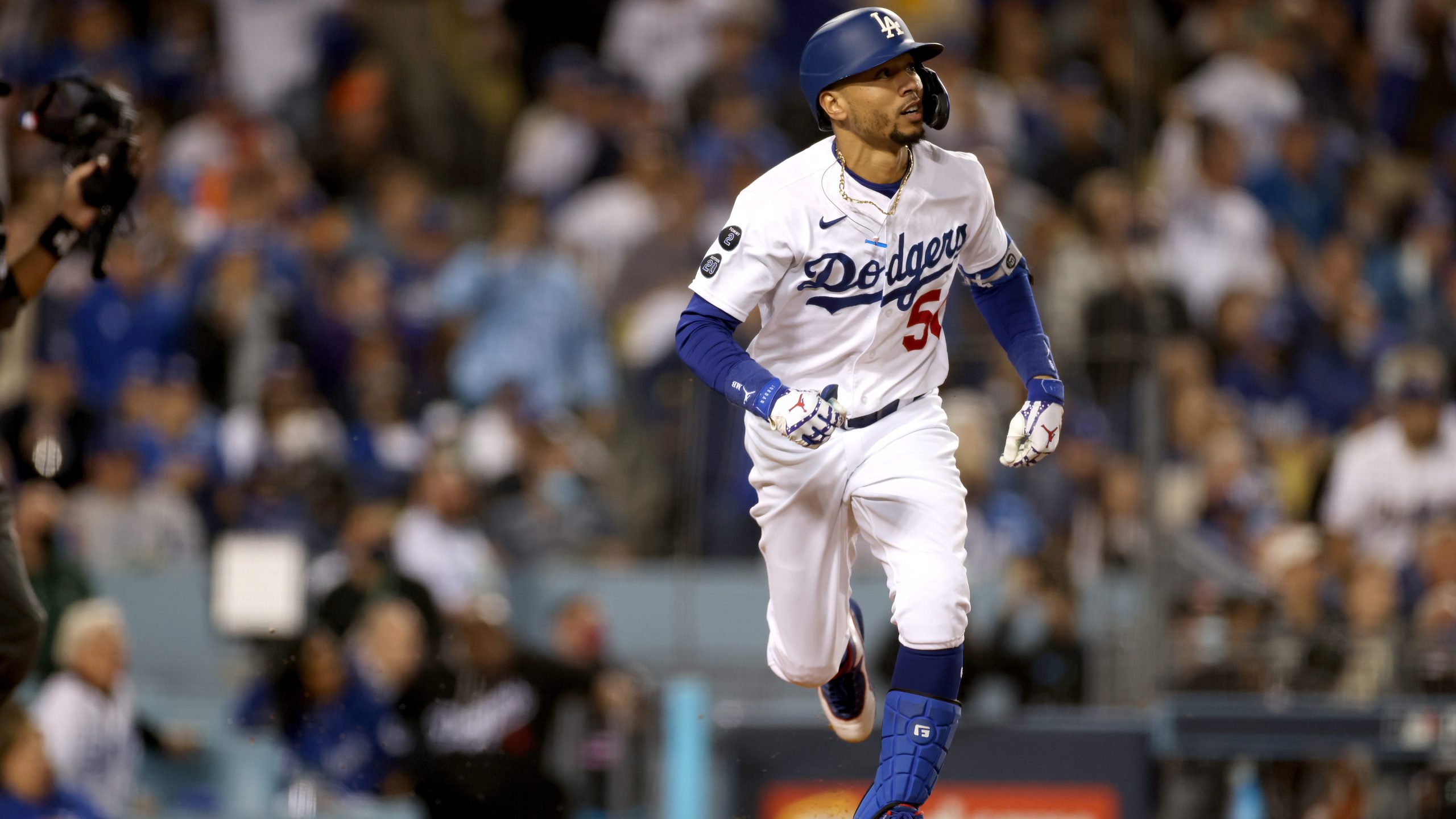 Mookie Betts of the Los Angeles Dodgers watches his two-run home run against the San Francisco Giants during the fourth inning in game 4 of the National League Division Series at Dodger Stadium on Oct. 12, 2021. (Harry How / Getty Images)