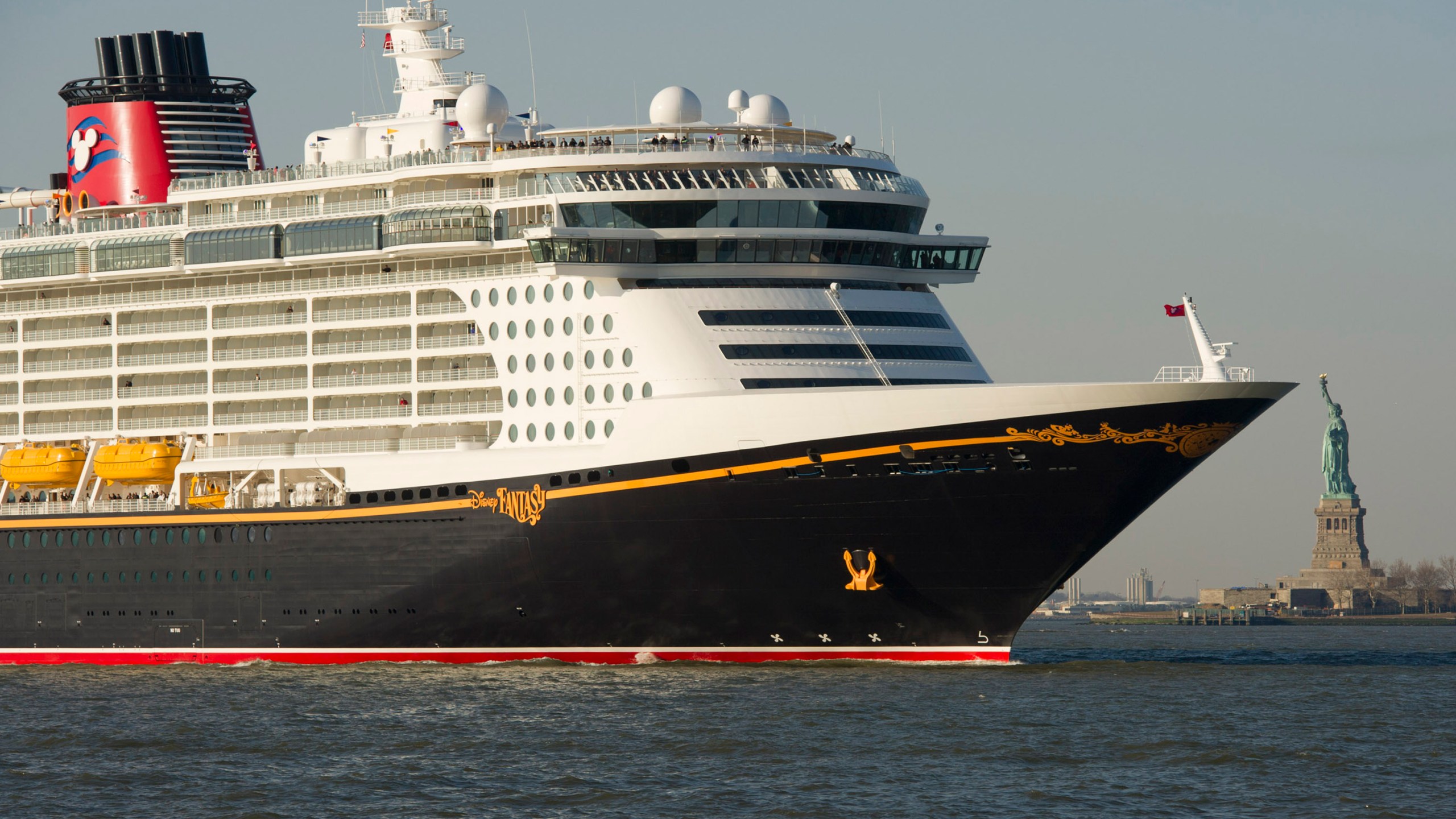 In this handout image provided by Disney Parks, DISNEY CRUISE LINE MAKES INAUGURAL VISIT TO NEW YORK: the Disney Fantasy, the newest ship of Disney Cruise Line ship, sails past the Statue of Liberty after traveling nearly 3,800 miles across the Atlantic Ocean from Bremerhaven, Germany. (David Roark/Disney Parks via Getty Images)