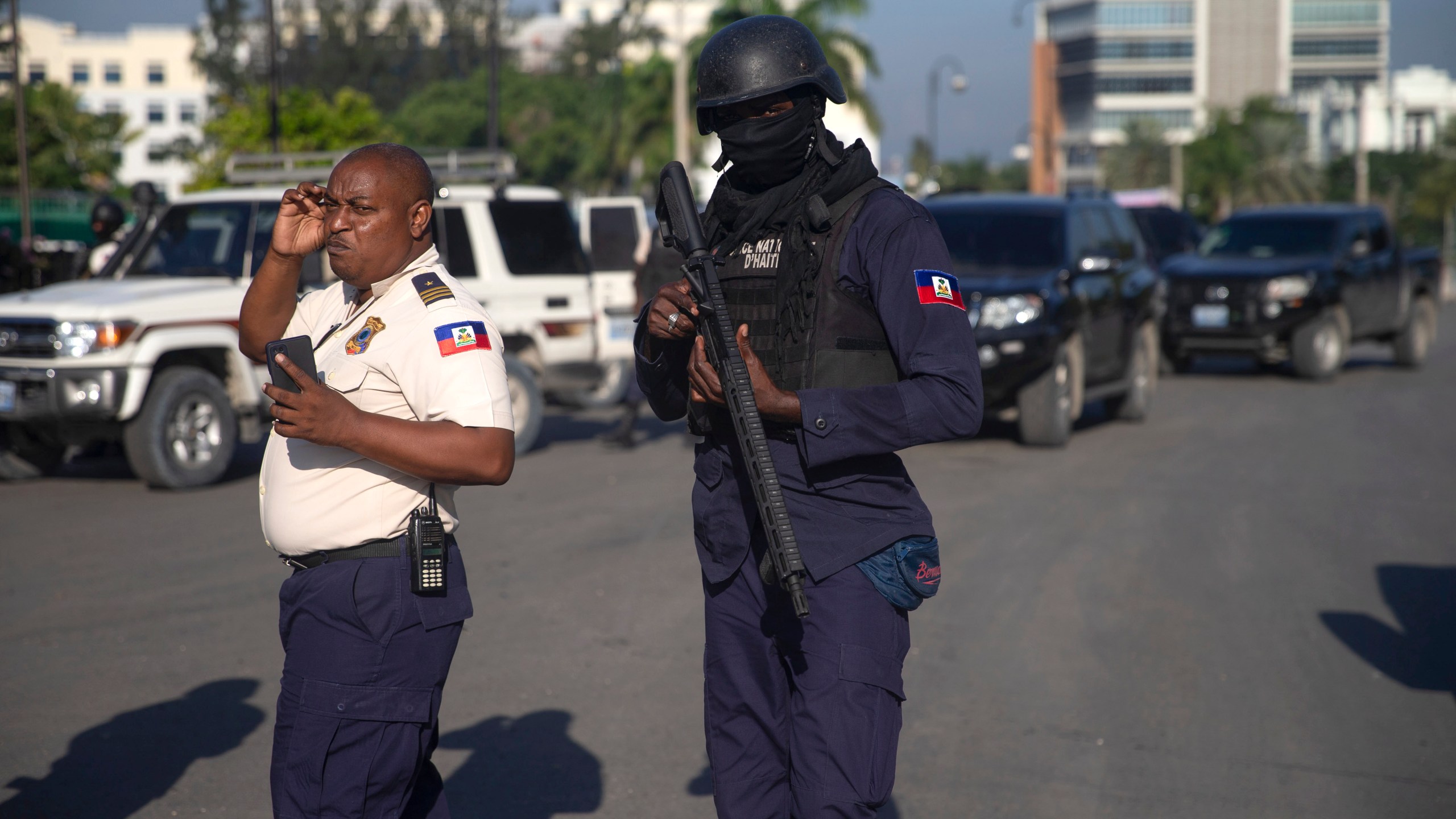 Armed forces secure the area where the Haiti's Prime Minister Ariel Henry placed a bouquet of flowers in front of independence hero Jean Jacques Dessalines memorial in Port-au-Prince, Haiti, Sunday, Oct. 17, 2021. A group of 17 missionaries including children was kidnapped by a gang in Haiti on Saturday, according to a voice message sent to various religious missions by an organization with direct knowledge of the incident. (AP Photo/Joseph Odelyn)