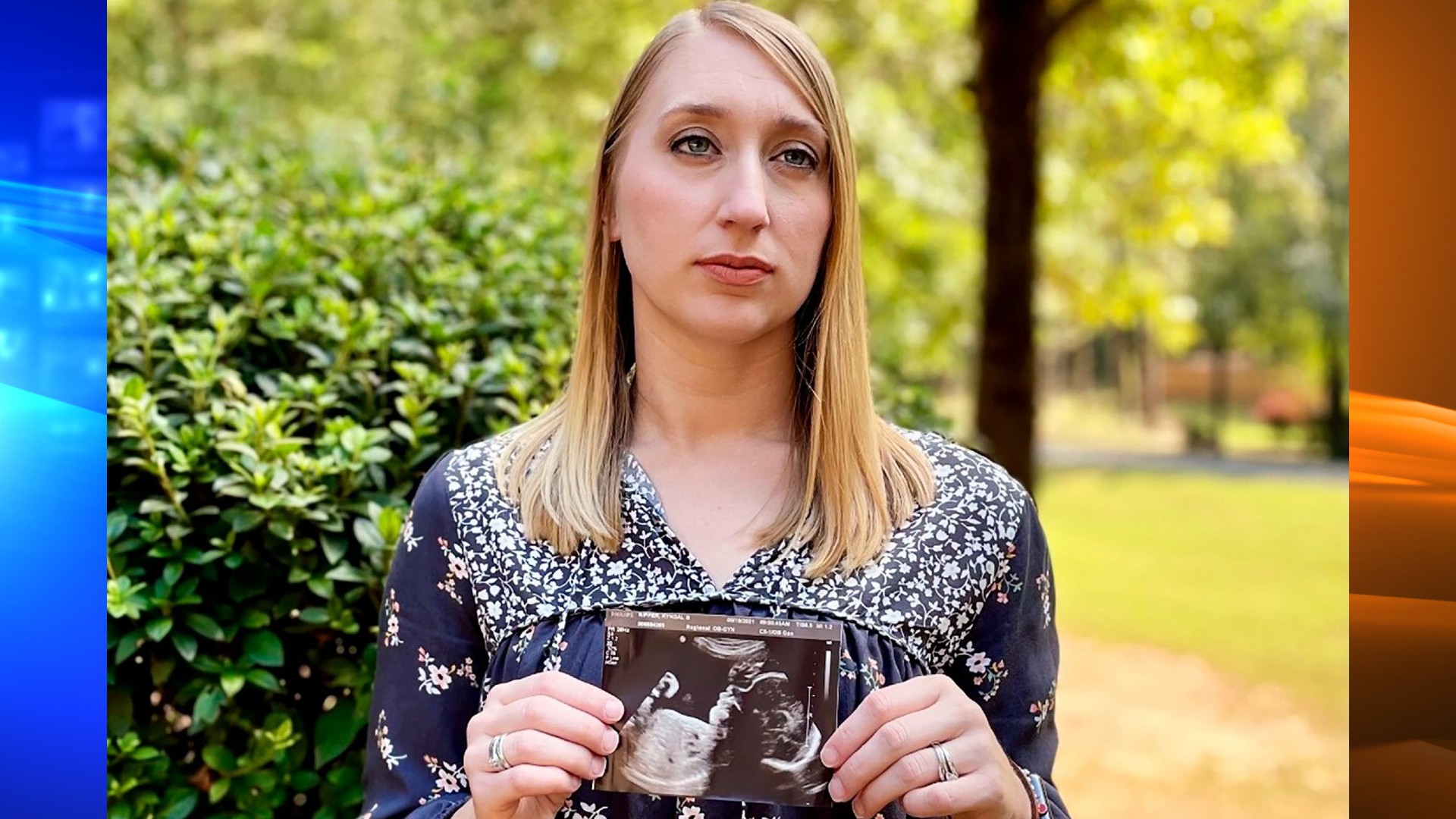 Kyndal Nipper, of Midland, Ga., who suffered a stillbirth after becoming ill with COVID-19 in her third trimester, holds an ultrasound image of the son she lost while standing outside her home on Friday, Oct. 15, 2021. Nipper, who was unvaccinated, is encouraging women to get vaccinated. (AP Photo/Kim Chandler)