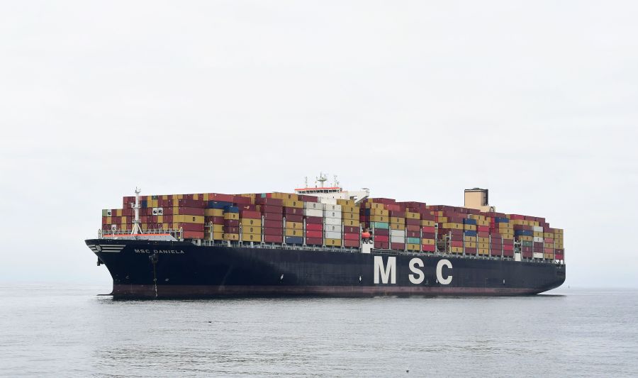 The Mediterranean Shipping Company cargo ship Daniela, filled with containers, waits offshore for entry to the Port of Los Angeles on Oct. 6, 2021 in San Pedro, California. A record number of cargo ships have been stuck in limbo off the Southern California coast waiting for entry to either the ports of Los Angeles or Long Beach. (Frederic J. Brown/AFP via Getty Images)