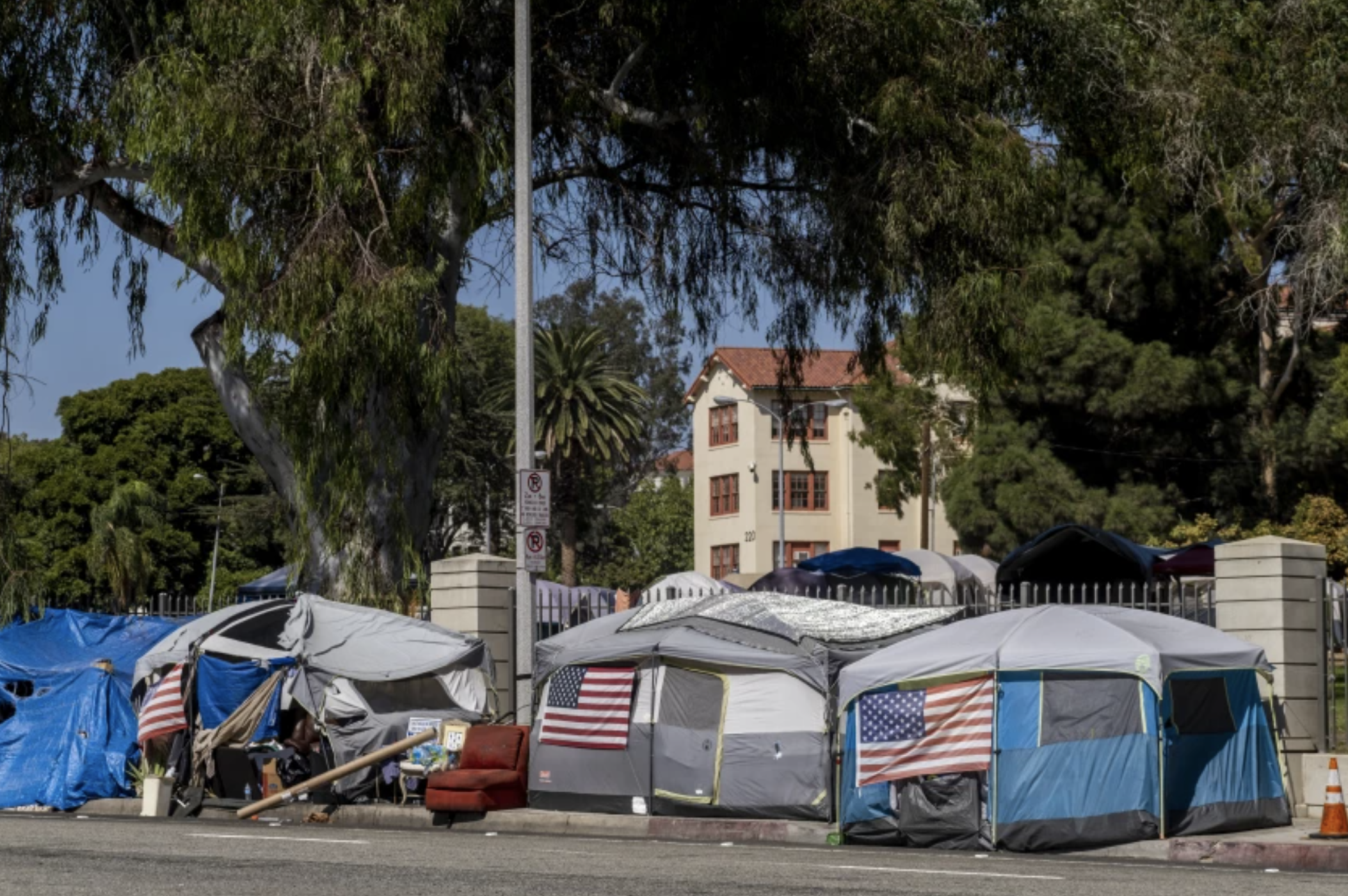 A homeless encampment known as Veterans Row outside the Veterans Affairs campus on San Vicente Boulevard in West Los Angeles.(Francine Orr / Los Angeles Times)