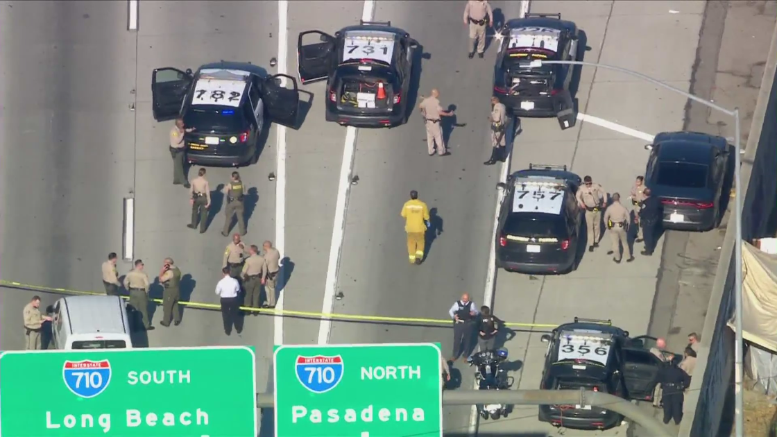 Authorities respond to a shooting at the 710 and 105 interchange in Paramount on Oct. 5, 2021. (KTLA)