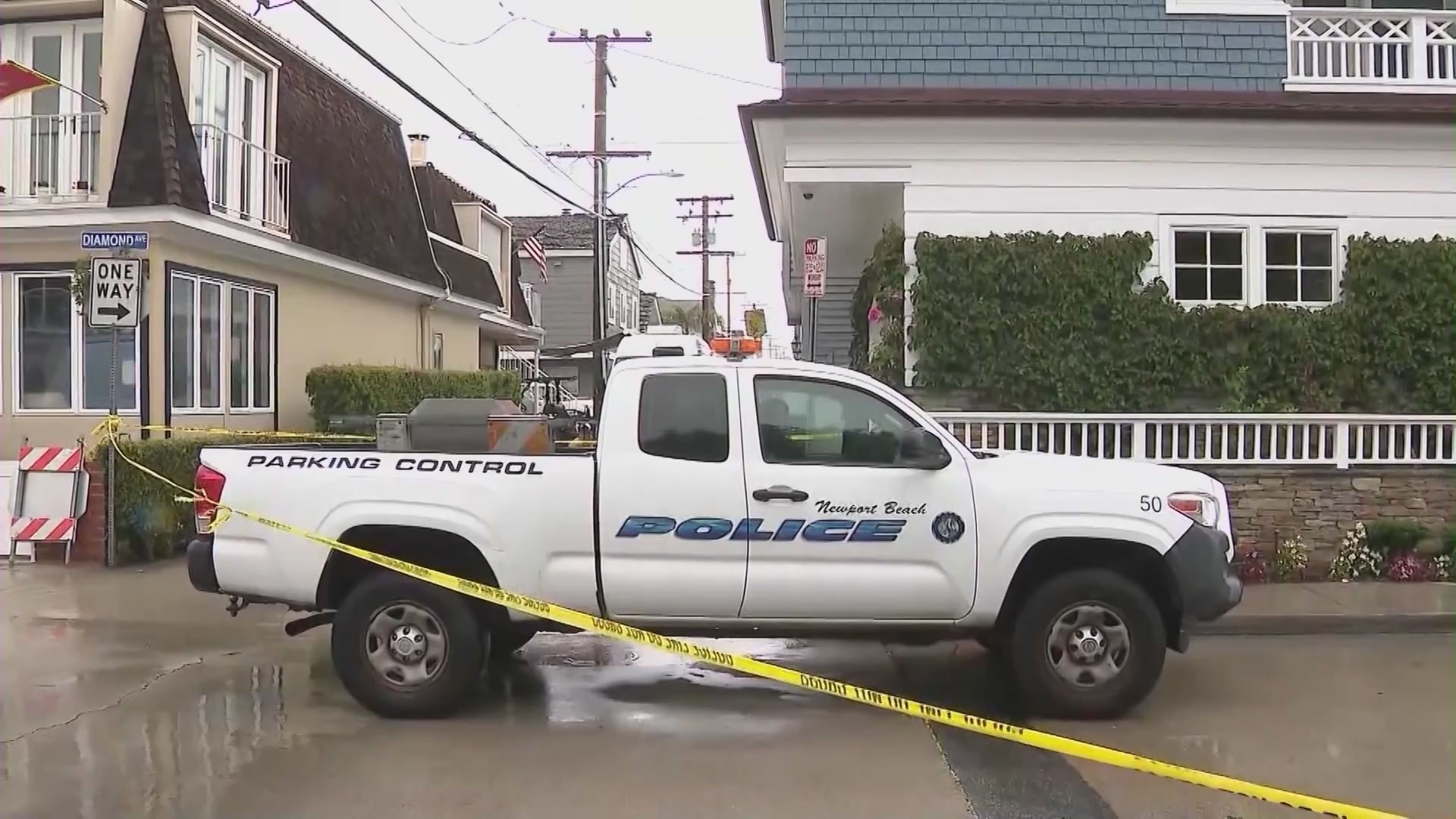 Newport Beach Police Department officers are investigating after three people were found dead in a back apartment unit on Balboa Island on Oct. 26, 2021. (KTLA)