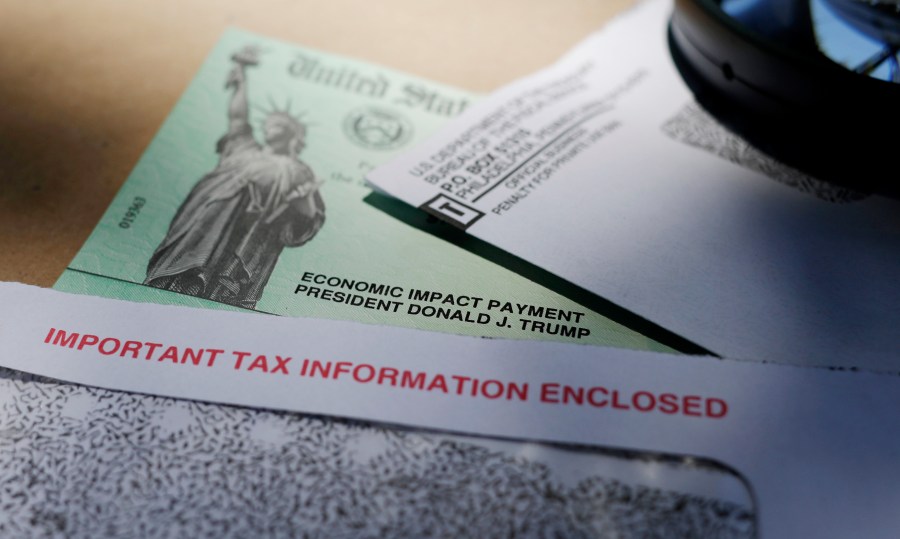 In this April 23, 2020, file photo, President Donald Trump's name is seen on a stimulus check issued by the IRS to help combat the adverse economic effects of the COVID-19 outbreak, in San Antonio. (AP Photo/Eric Gay, File)