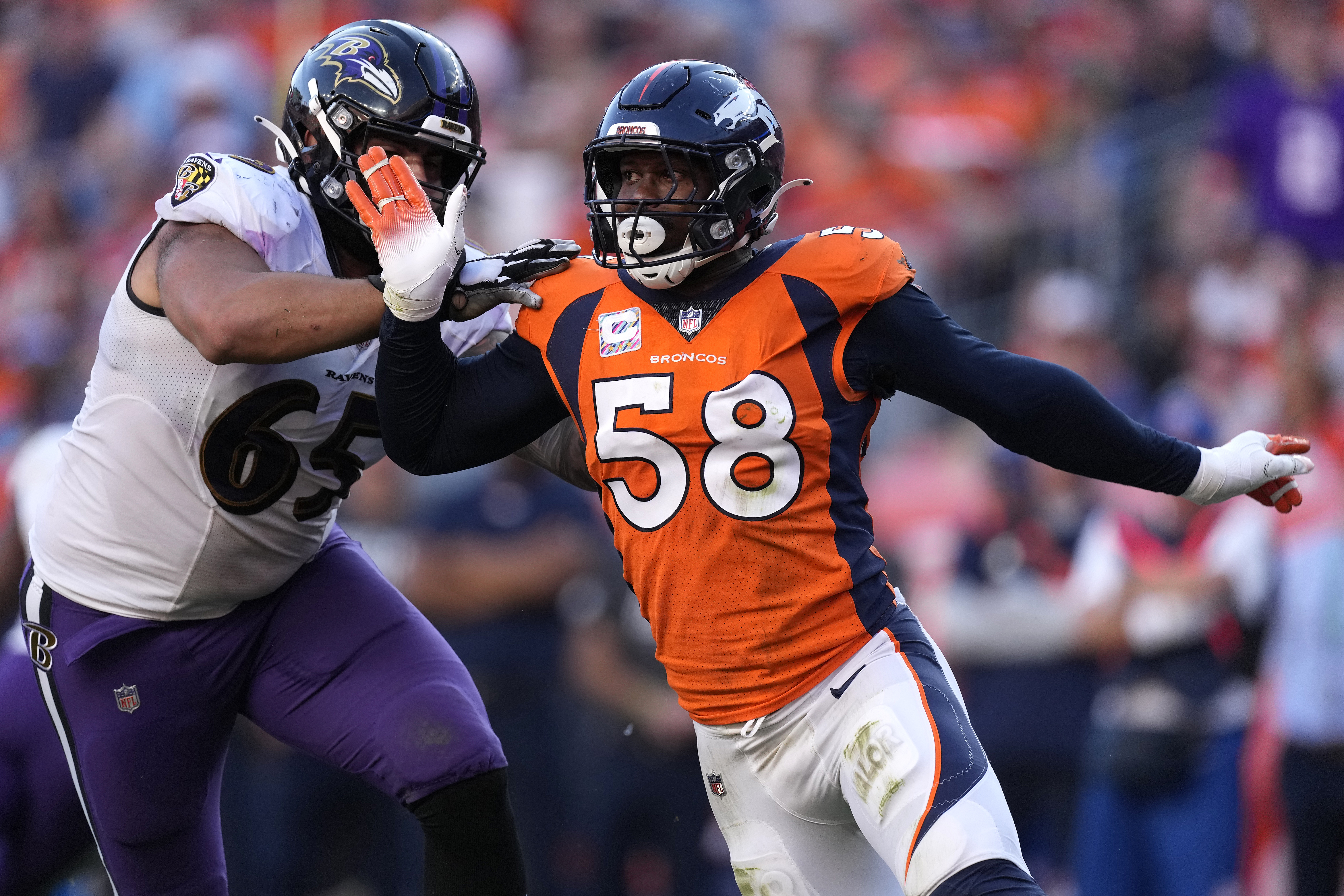 Denver Broncos outside linebacker Von Miller (58) battles against Baltimore Ravens offensive tackle Patrick Mekari (65) during the second half of an NFL football game, Sunday, Oct. 3, 2021, in Denver. (AP Photo/David Zalubowski)