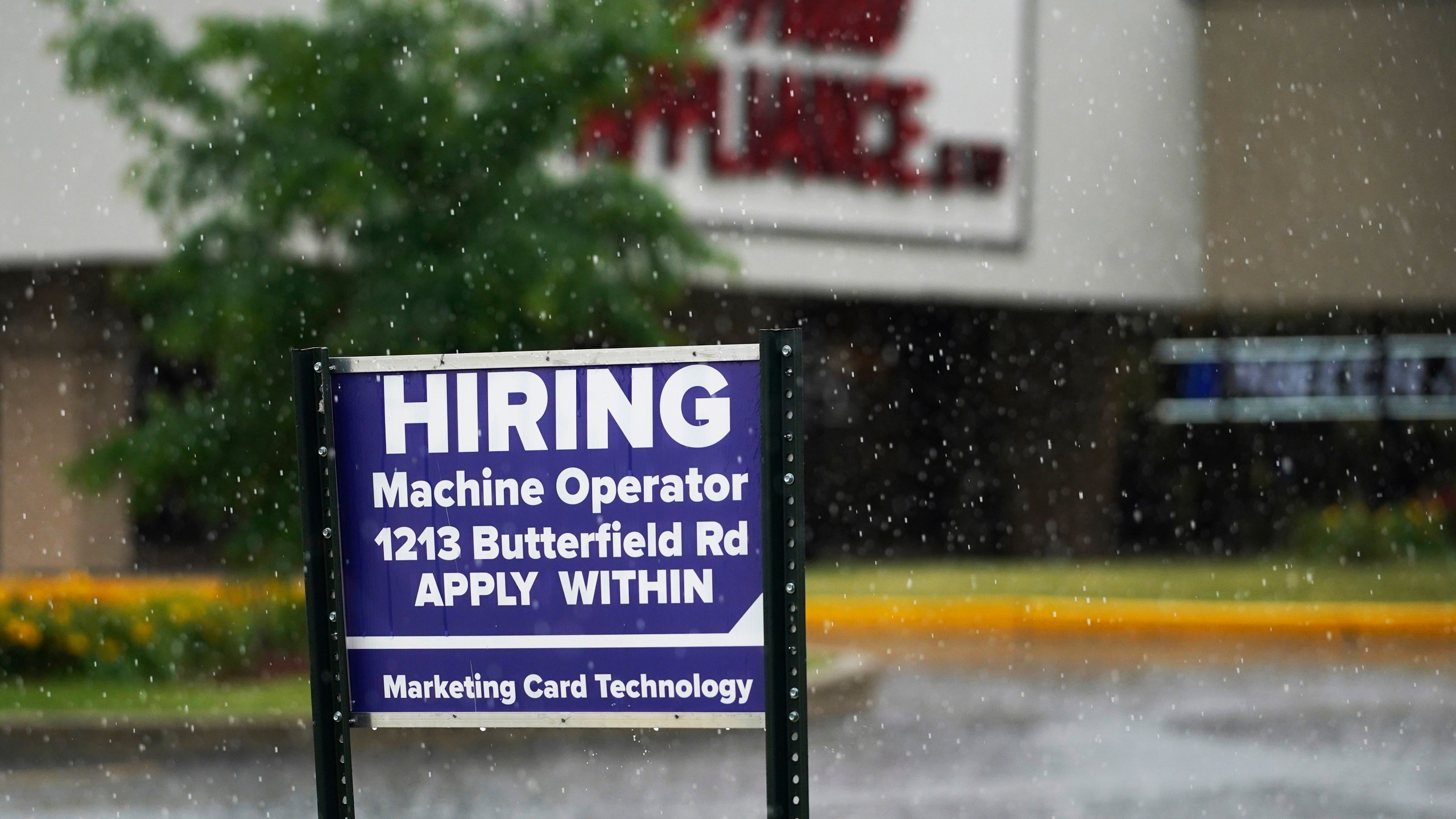 A hiring sign is displayed in Downers Grove, Ill., on June 24, 2021. (AP Photo/Nam Y. Huh, File)