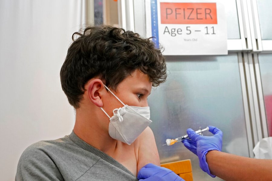 Leo Hahn, 11, gets the first shot of the Pfizer COVID-19 vaccine, Tuesday, Nov. 9, 2021, at the University of Washington Medical Center in Seattle. (AP Photo/Ted S. Warren)