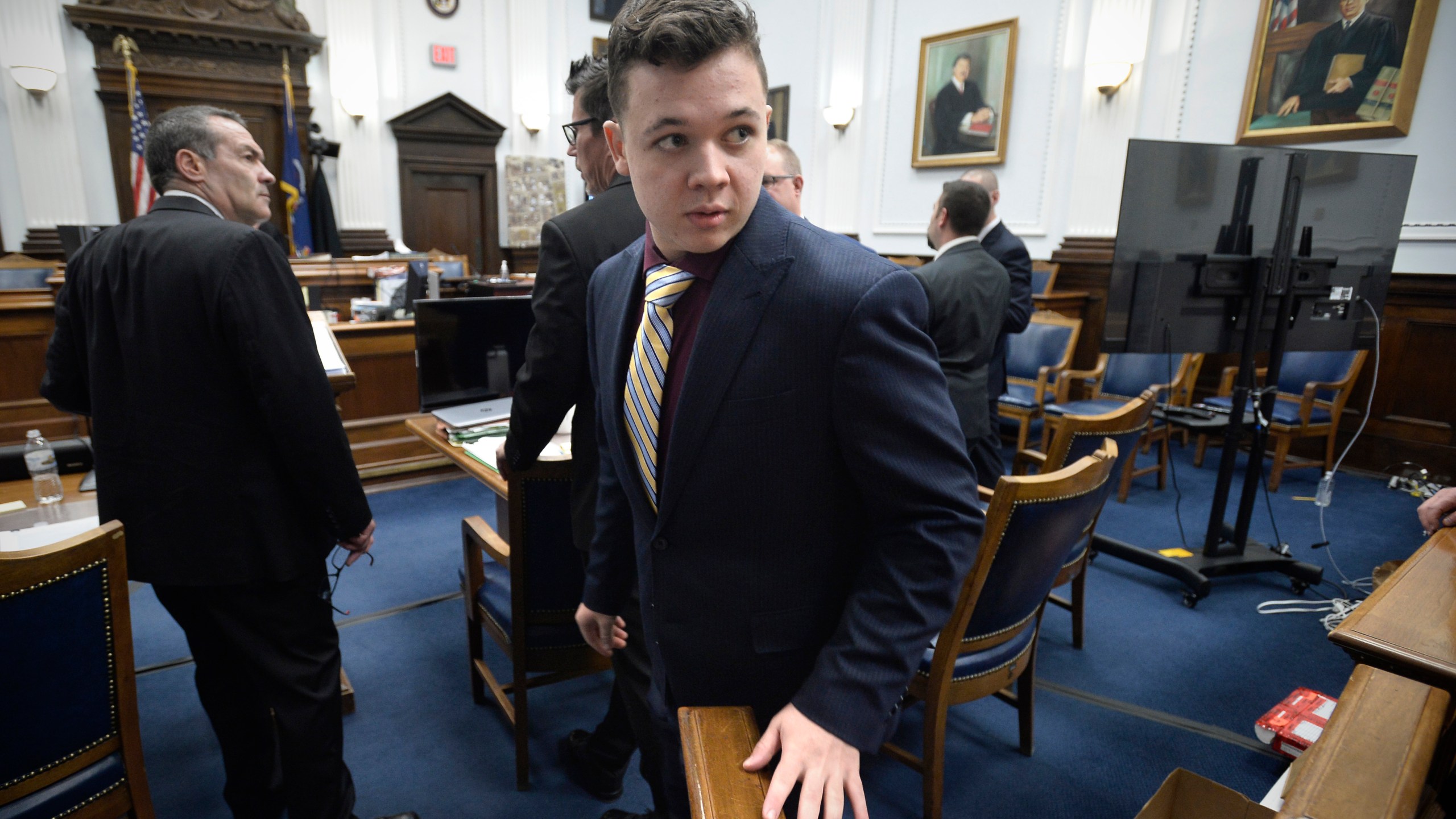 Kyle Rittenhouse, center, enters the courtroom after a break at the Kenosha County Courthouse in Kenosha, Wis., on Nov. 11, 2021. Rittenhouse is accused of killing two people and wounding a third during a protest over police brutality in Kenosha, last year. (Sean Krajacic/The Kenosha News via AP, Pool)