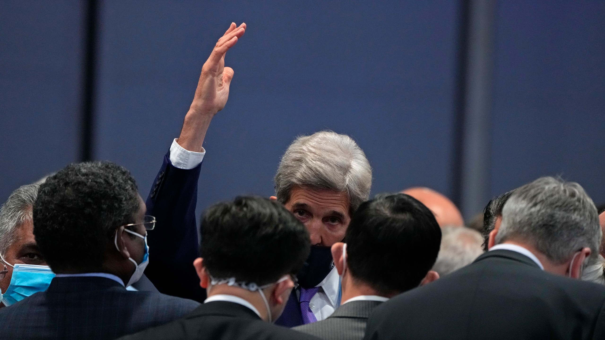 John Kerry, United States Special Presidential Envoy for Climate gestures at the end of a stocktaking plenary session at the COP26 U.N. Climate Summit in Glasgow, Scotland, Saturday, Nov. 13, 2021. (AP Photo/Alastair Grant)