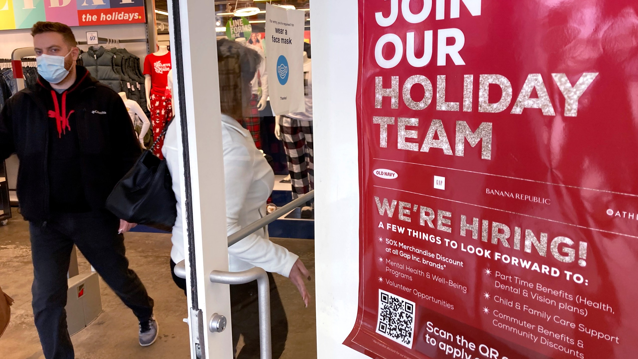 Holiday hiring sign is displayed at a retail store in Vernon Hills, Ill., Saturday, Nov. 13, 2021. (AP Photo/Nam Y. Huh)