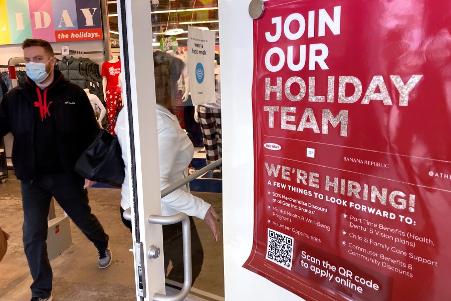 Holiday hiring sign is displayed at a retail store in Vernon Hills, Ill., Saturday, Nov. 13, 2021. (AP Photo/Nam Y. Huh)