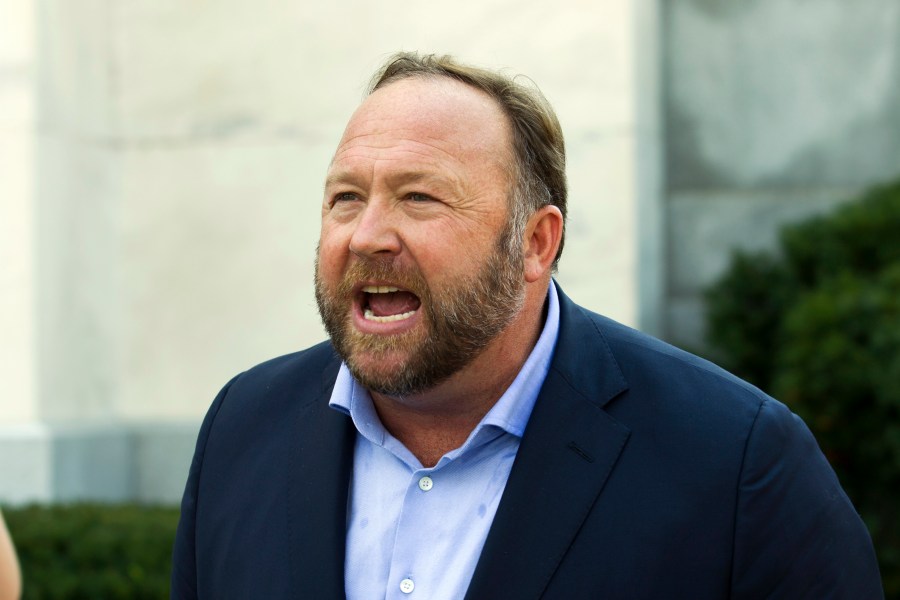 In this Sept. 5, 2018, file photo, Infowars host and conspiracy theorist Alex Jones speaks outside of the Dirksen building on Capitol Hill in Washington. (Jose Luis Magana/Associated Press)