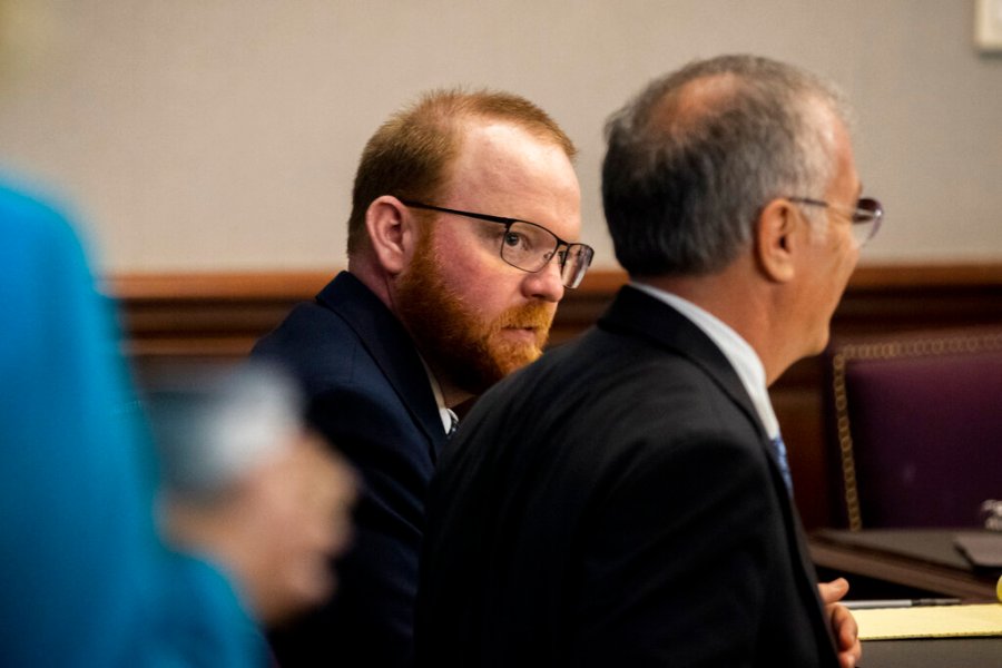 Travis McMichael, center, listens to his attorney Bob Rubin, right, during his trial in the Glynn County Courthouse, Tuesday, Nov. 16, 2021, in Brunswick, Ga. (AP Photo/Stephen B. Morton, Pool)