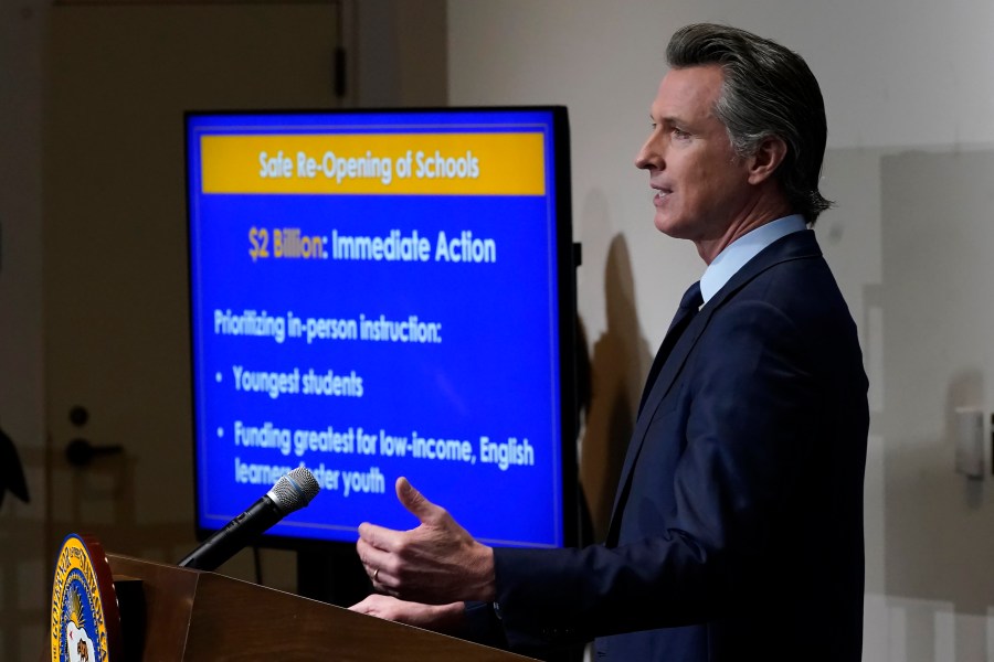 California Gov. Gavin Newsom speaks about his 2021-2022 state budget proposal during a news conference in Sacramento, Calif., on Jan. 8, 2021. California will have a $31 billion budget surplus next year as revenues continue to climb despite the pandemic, according to a new forecast from the state's independent Legislative Analyst's Office. (AP Photo/Rich Pedroncelli, Pool, File)