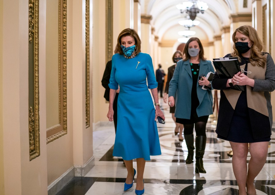 Speaker of the House Nancy Pelosi, D-Calif., leaves the chamber after midnight during a lengthy floor speech by House Minority Leader Kevin McCarthy, R-Calif., who disrupted a planned vote on President Joe Biden's domestic agenda, the Build Back Better Act, at the Capitol in Washington, early Friday, Nov. 19, 2021. (AP Photo/J. Scott Applewhite)