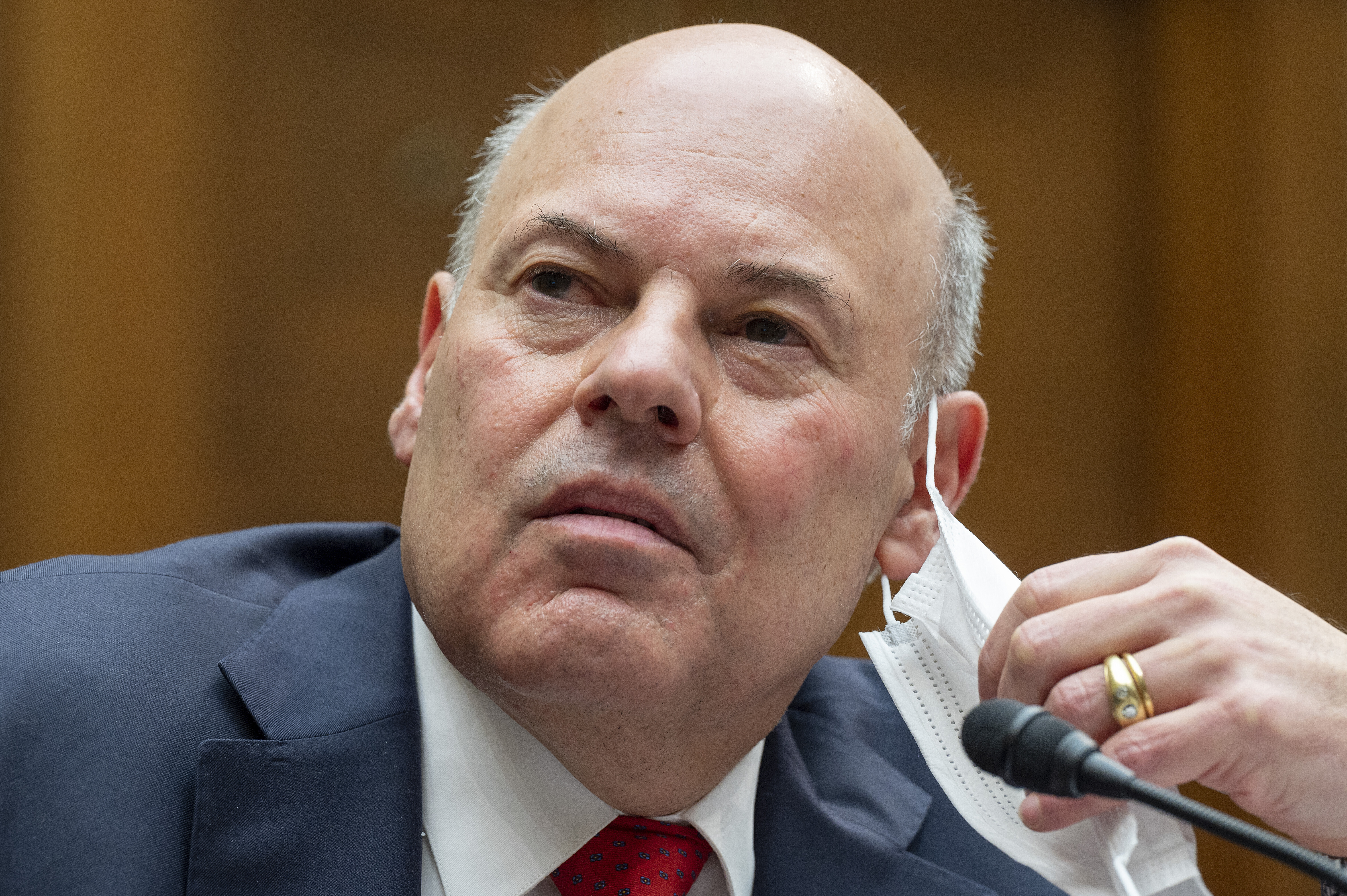 United States Postal Service Postmaster General Louis DeJoy speaks during a House Oversight and Reform Committee hearing, Feb. 24, 2021, in Washington. (Jim Watson/Pool via AP, File)