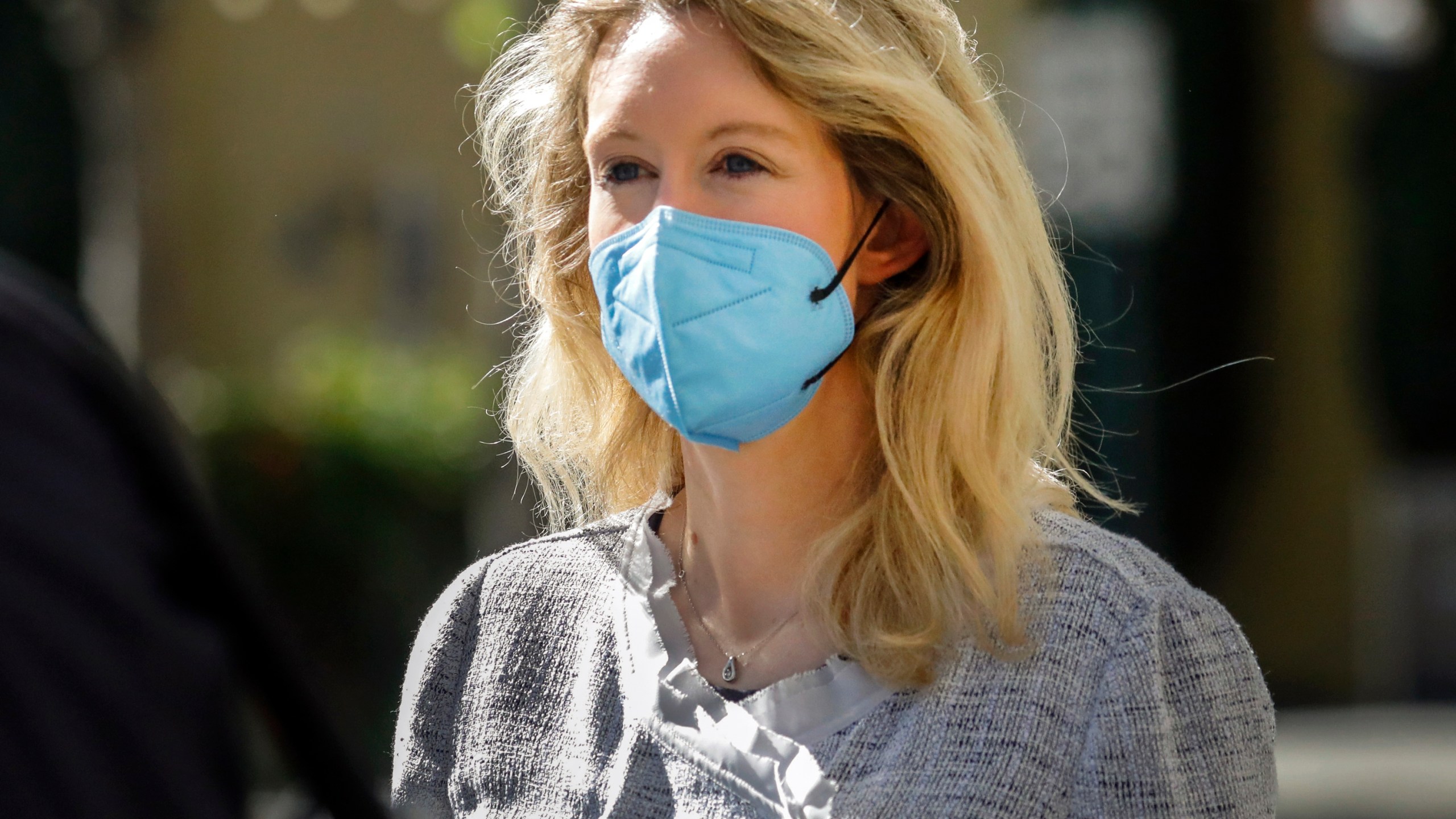 Elizabeth Holmes, founder and CEO of Theranos, left, leaves the Robert F. Peckham Federal Building in downtown San Jose on May 4, 2021. (Nhat V. Meyer/Bay Area News Group via Associated Press)