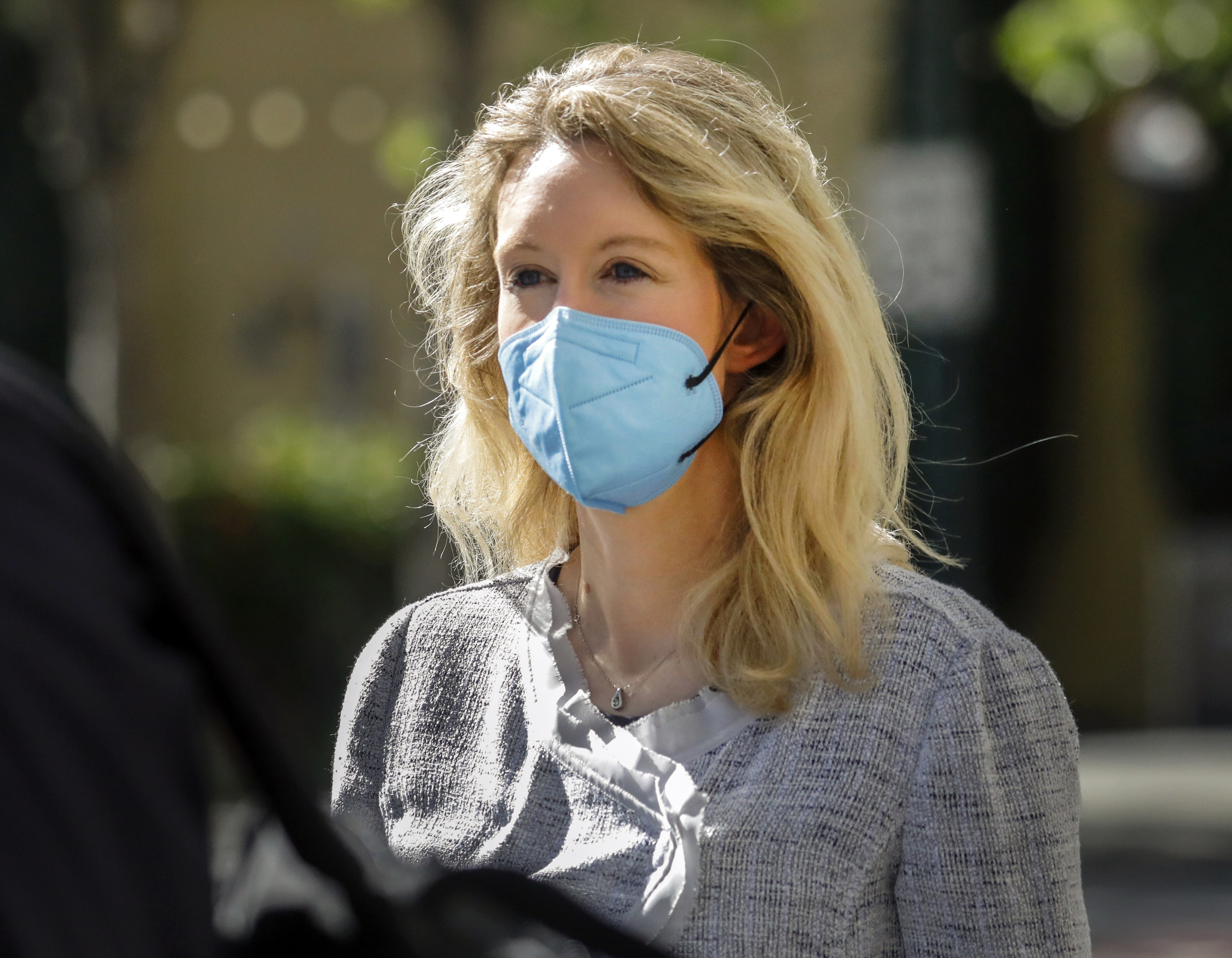 Elizabeth Holmes, founder and CEO of Theranos, left, leaves the Robert F. Peckham Federal Building in downtown San Jose on May 4, 2021. (Nhat V. Meyer/Bay Area News Group via Associated Press)