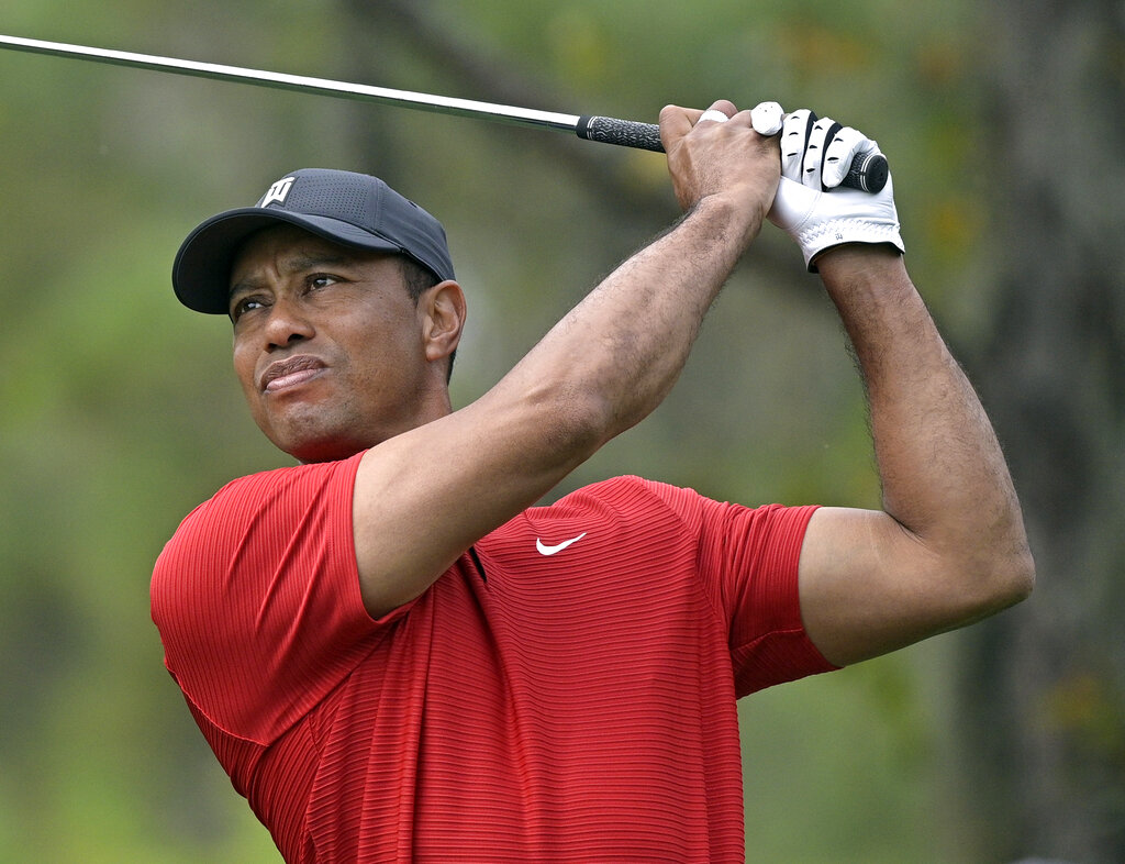 Tiger Woods watches his tee shot on the fourth hole during the final round of the PNC Championship golf tournament Dec. 20, 2020, in Orlando, Fla. (AP Photo/Phelan M. Ebenhack, File)