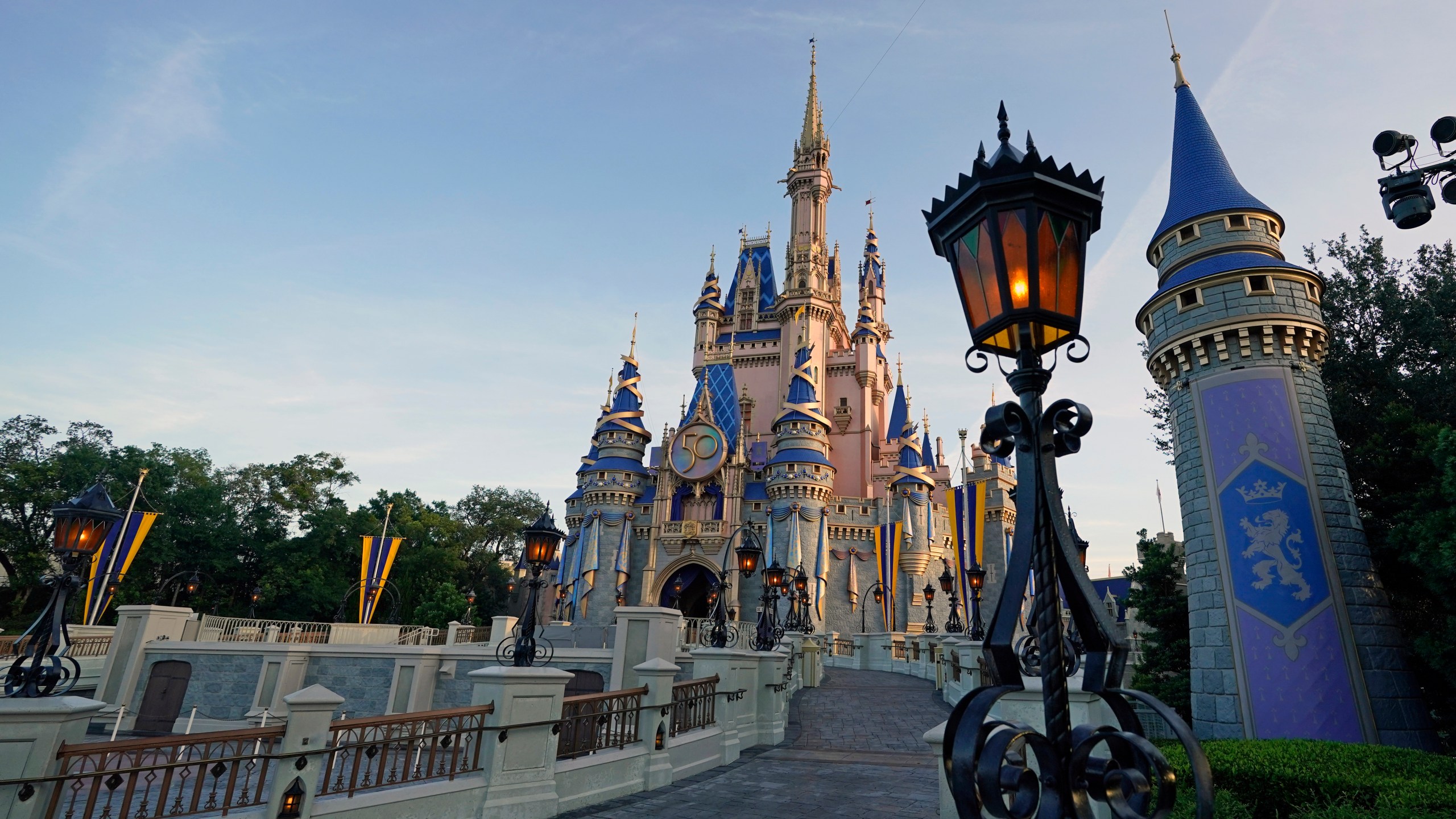 The Cinderella Castle at the Magic Kingdom at Walt Disney World is seen at the theme park, Aug. 30, 2021, in Lake Buena Vista, Fla. Disney has paused its policy requiring Florida-based employees to take the COVID-19 vaccine following new laws passed by the state's legislature last week that limit employers' power to require vaccinations, according to a memo sent to employees. The company informed employees in a memo sent Friday that it has paused the requirement due to the state legislature's action during a special session last week, and because of an appeal court's temporary delay of federal vaccination guidelines from the Occupational Safety and Health Administration, the Orlando Sentinel reported. (AP Photo/John Raoux, file)