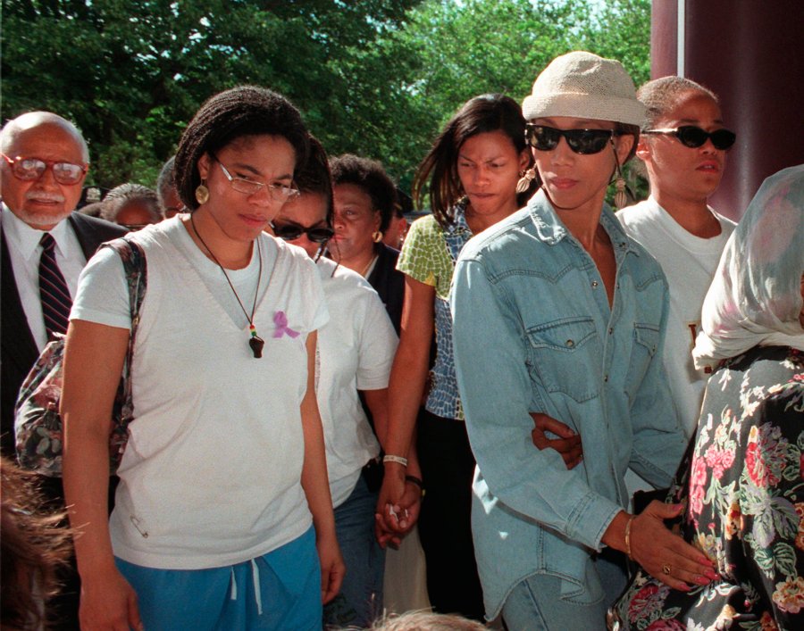 Malikah Shabazz, left, daughter of Malcolm X, walks with her sisters, Ilyasah, third from right, Attallah, second from right, and Malaak, after talking to the media following the death of their mother Betty Shabazz, June 23, 1997 in New York. Malikah Shabazz, was found dead in her home in New York City from what appeared to be natural causes, police said Tuesday, Nov. 23, 2021. She was 56. (AP Photo/Ron Frehm, File)