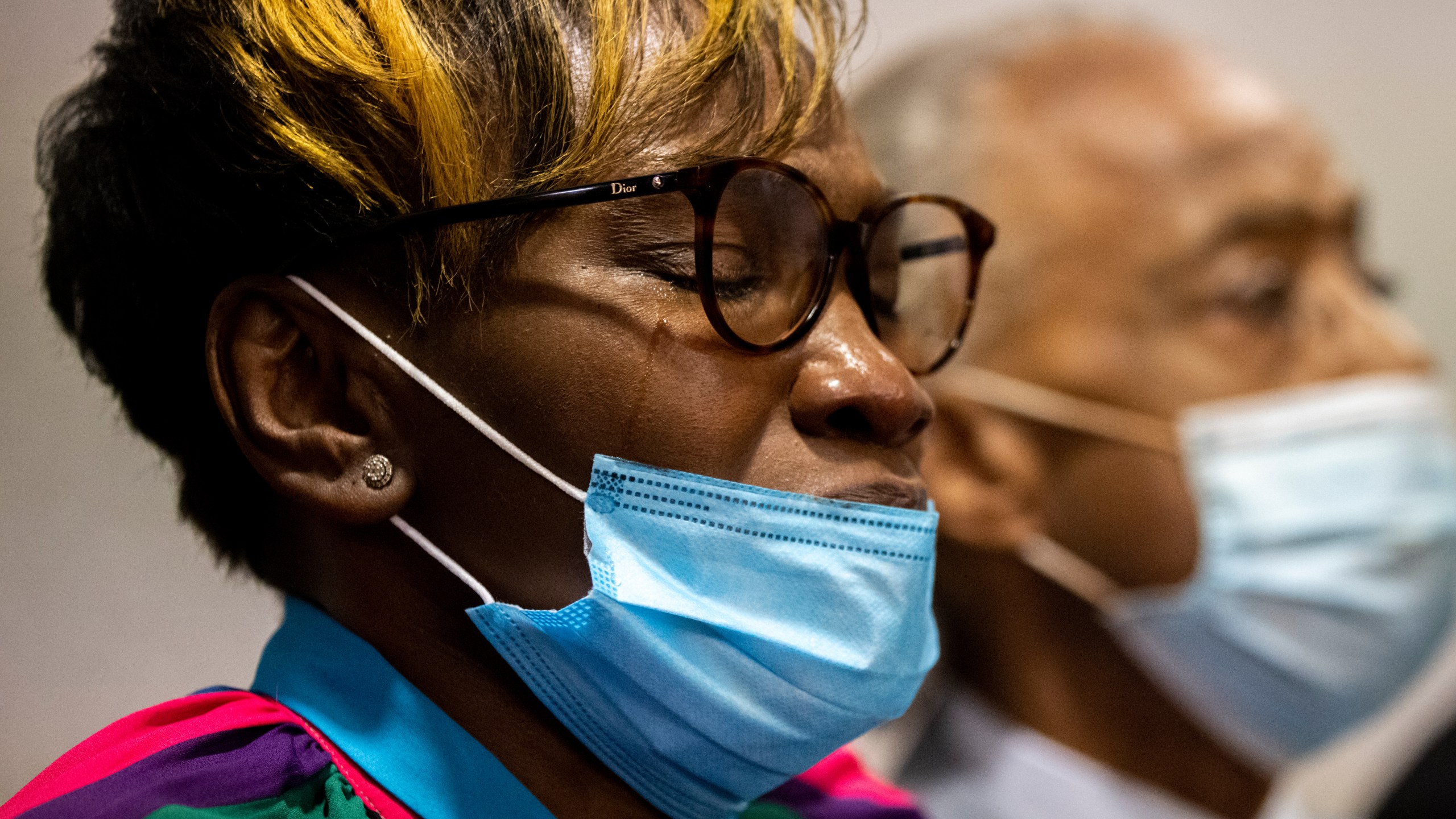 Tears streak down the cheek of Ahmaud Arbery's mother Wanda Cooper-Jones after the jury convicted Travis McMichael in the Glynn County Courthouse, Wednesday, Nov. 24, 2021, in Brunswick, Ga. (AP Photo/Stephen B. Morton, Pool)