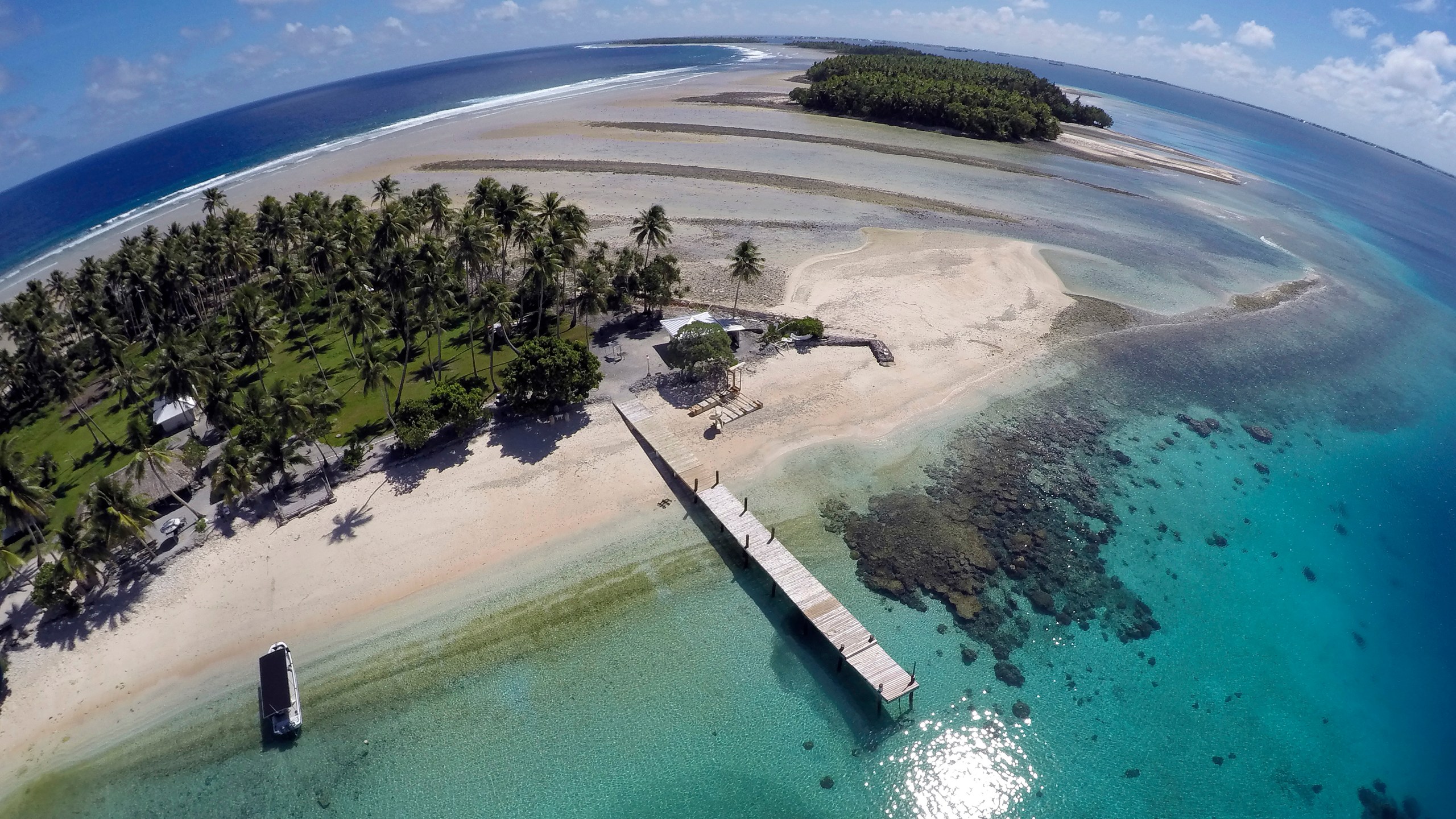 An aerial photo shows a small section of the atoll that has slipped beneath the water line only showing a small pile of rocks at low tide on Majuro Atoll in the Marshall Islands on Nov. 8, 2015. (AP Photo/Rob Griffith, File)