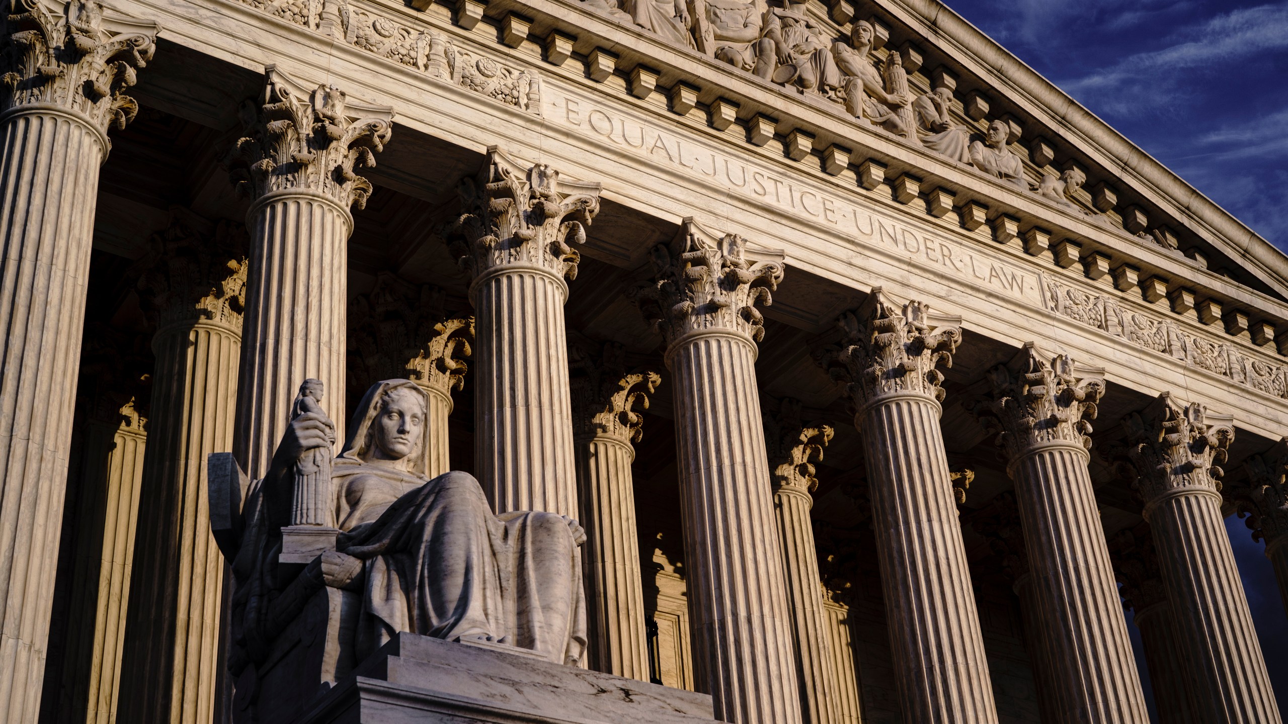 The Supreme Court is seen at dusk in Washington, Oct. 22, 2021. Both sides are telling the Supreme Court there’s no middle ground in Wednesday’s showdown over abortion. (AP Photo/J. Scott Applewhite, File)