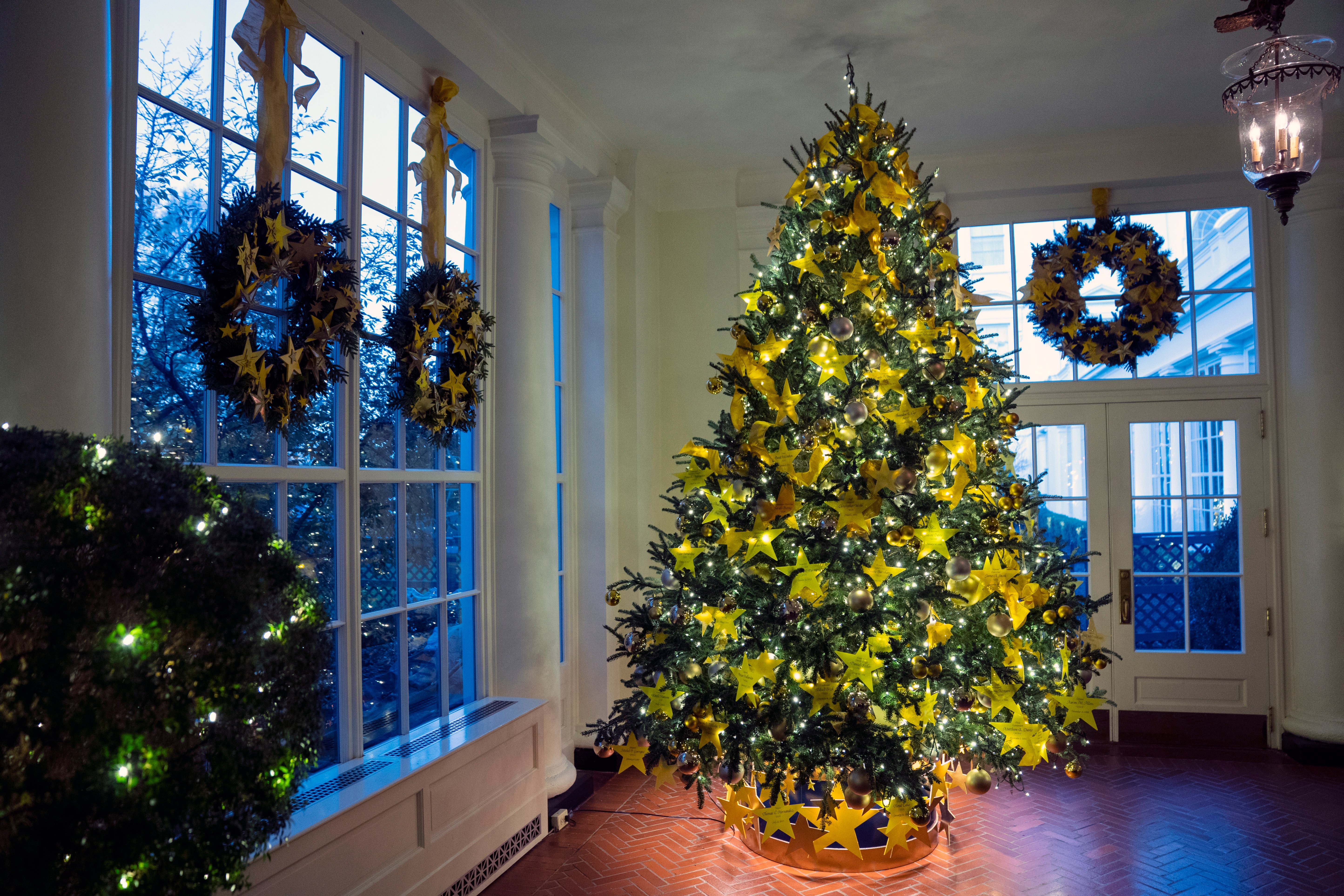 The Gold Star Tree sits in the East Landing of the White House during a preview of the White House holiday decorations, Monday, Nov. 29, 2021, in Washington. (AP Photo/Evan Vucci)