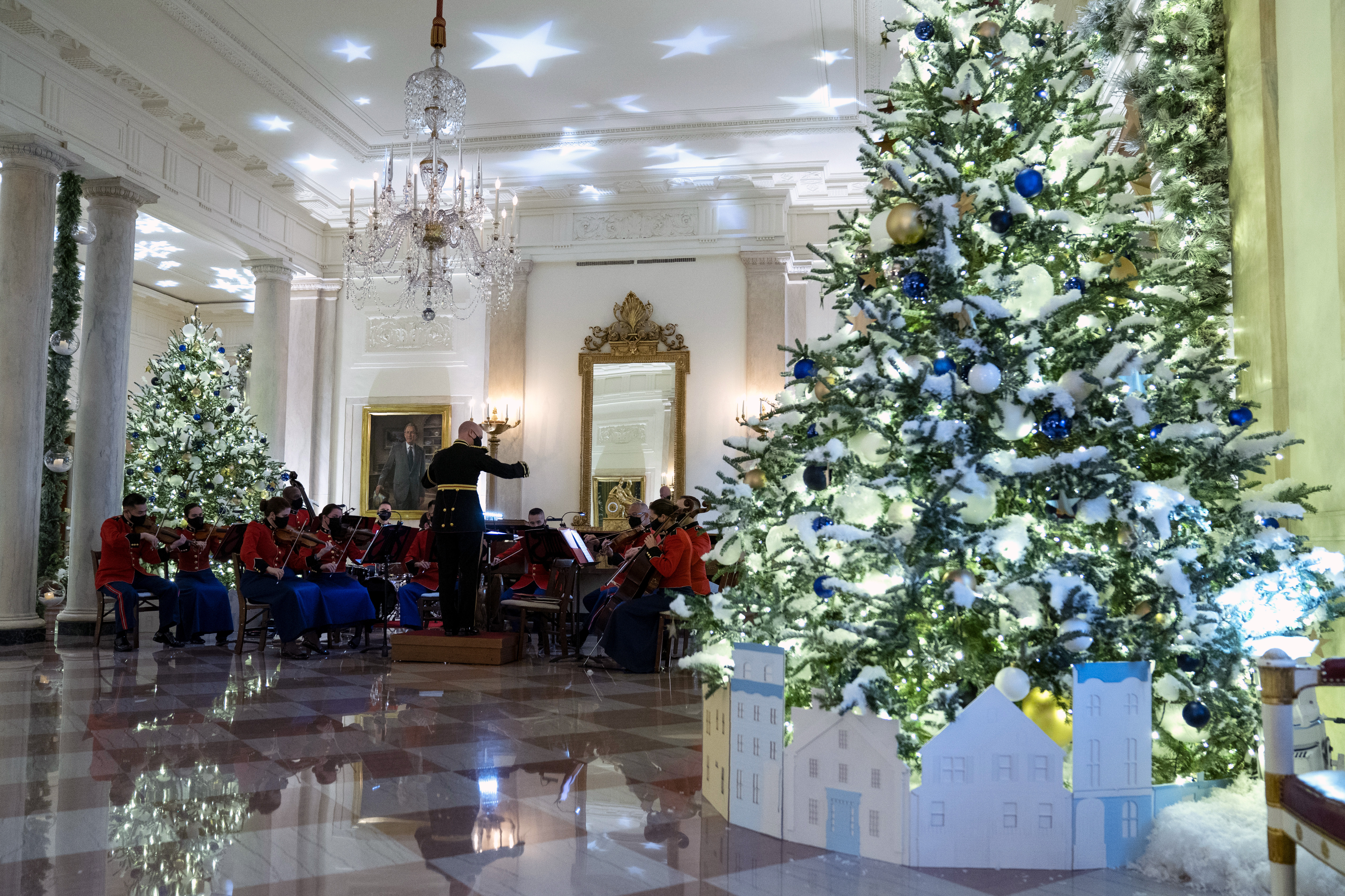 A Marine band plays Christmas music in the Grand Foyer of the White House during a press preview of the White House holiday decorations, Monday, Nov. 29, 2021, in Washington. (AP Photo/Evan Vucci)