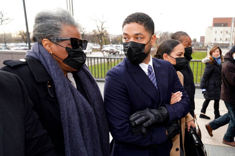 Actor Jussie Smollett looks back at his mother as they arrive with other family members Monday, Nov. 29, 2021, at the Leighton Criminal Courthouse for jury selection at his trial in Chicago. (AP Photo/Charles Rex Arbogast)