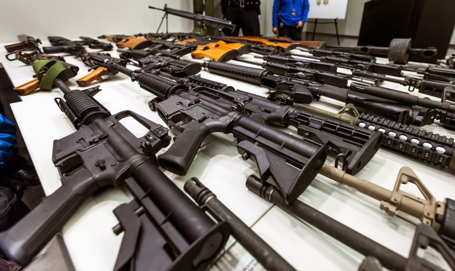 In this Dec. 27, 2012, file photo, a variety of military-style semi-automatic rifles obtained during a buy back program are displayed at Los Angeles police headquarters. The 9th U.S. Circuit Court of Appeals overturned two lower court judges and upheld California’s ban on high-capacity magazines Nov. 30, 2021, in a split decision that may be headed for the U.S. Supreme Court. (Damian Dovarganes/Associated Press)