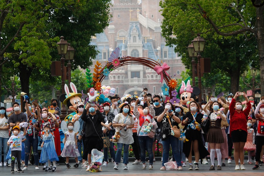 Tourists visit Shanghai Disneyland after its reopening on May 11, 2020 in Shanghai, China. (Hu Chengwei/Getty Images)