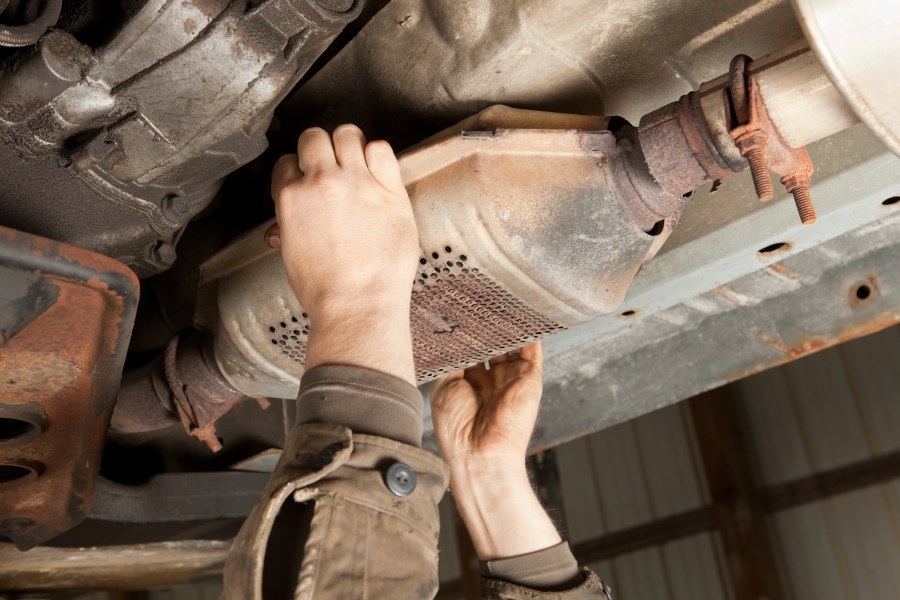 This file photo shows an SUV's catalytic converter is being removed at a salvage yard. (Getty Images)