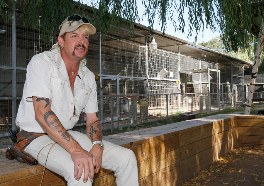 In this Aug. 28, 2013, file photo, Joseph Maldonado-Passage, also known as Joe Exotic, is seen at the zoo he used to run in Wynnewood, Okla. The former zookeeper has been transferred to a medical facility in North Carolina for federal inmates after a cancer diagnosis, according to his attorney. (AP Photo/Sue Ogrocki, File)