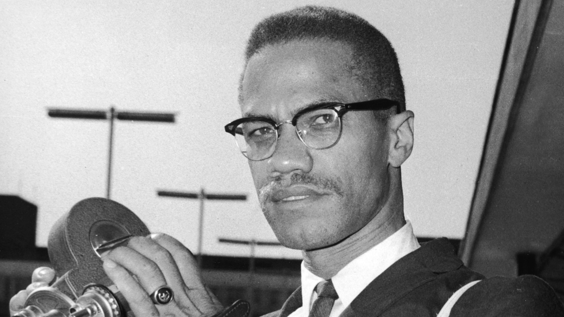 Portrait of American political activist and radical civil rights leader Malcolm X (1925 - 1965) in London Airport, London, England, July 9, 1964. (Photo by Express Newspapers/Getty Images)