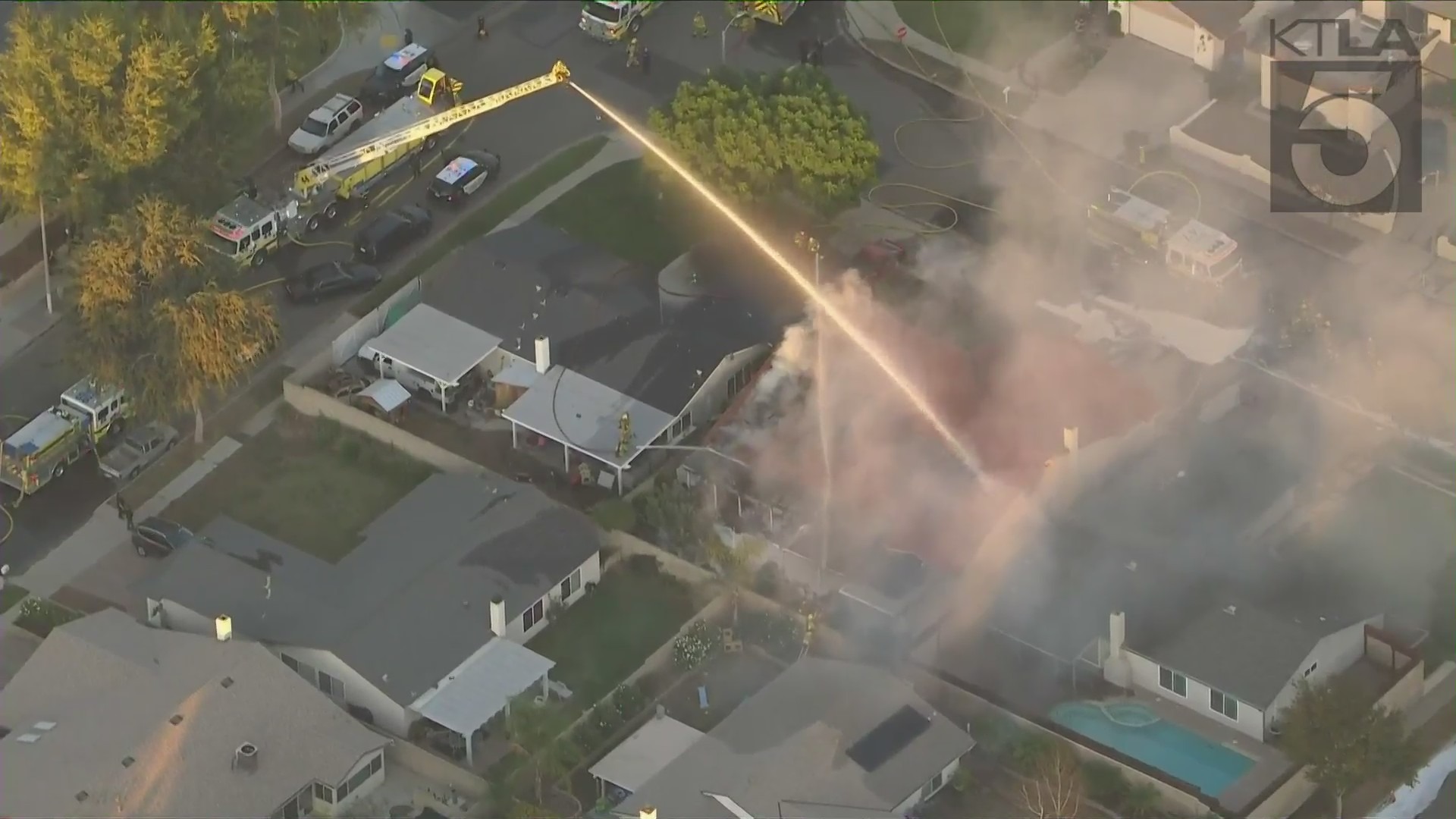 Simi Valley Police Department officers assisted members of the Ventura County Fire Department as they battled a blaze in Simi Valley on Nov. 5, 2021. (KTLA)