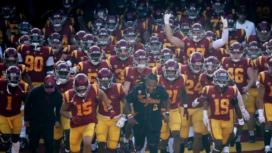 The USC Trojans take the field for a game against Arizona at the Coliseum in Los Angeles on Oct. 30. The Trojans’ next game against Cal has been canceled due to COVID-19 cases among the Golden Bears. (Luis Sinco / Los Angeles Times)