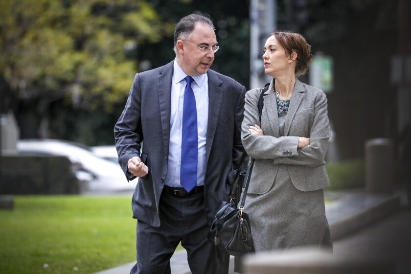 Paul Paradis is seen with attorney Angela Machala outside L.A. County Superior Court in 2019.(Irfan Khan / Los Angeles Times)