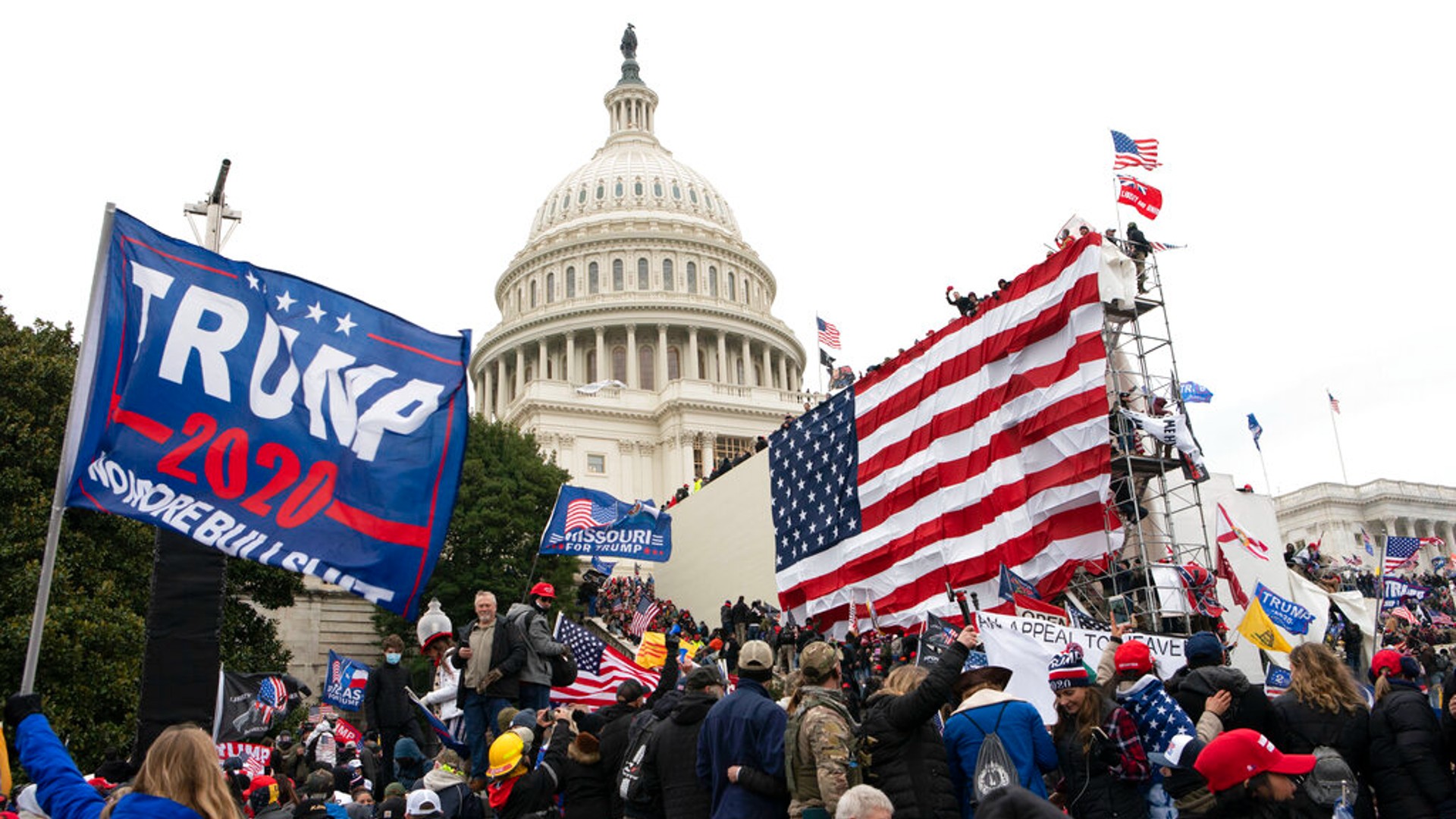 Violent insurrectionists loyal to President Donald Trump stand outside the U.S. Capitol in Washington on Jan. 6, 2021. (AP Photo/Jose Luis Magana, File)