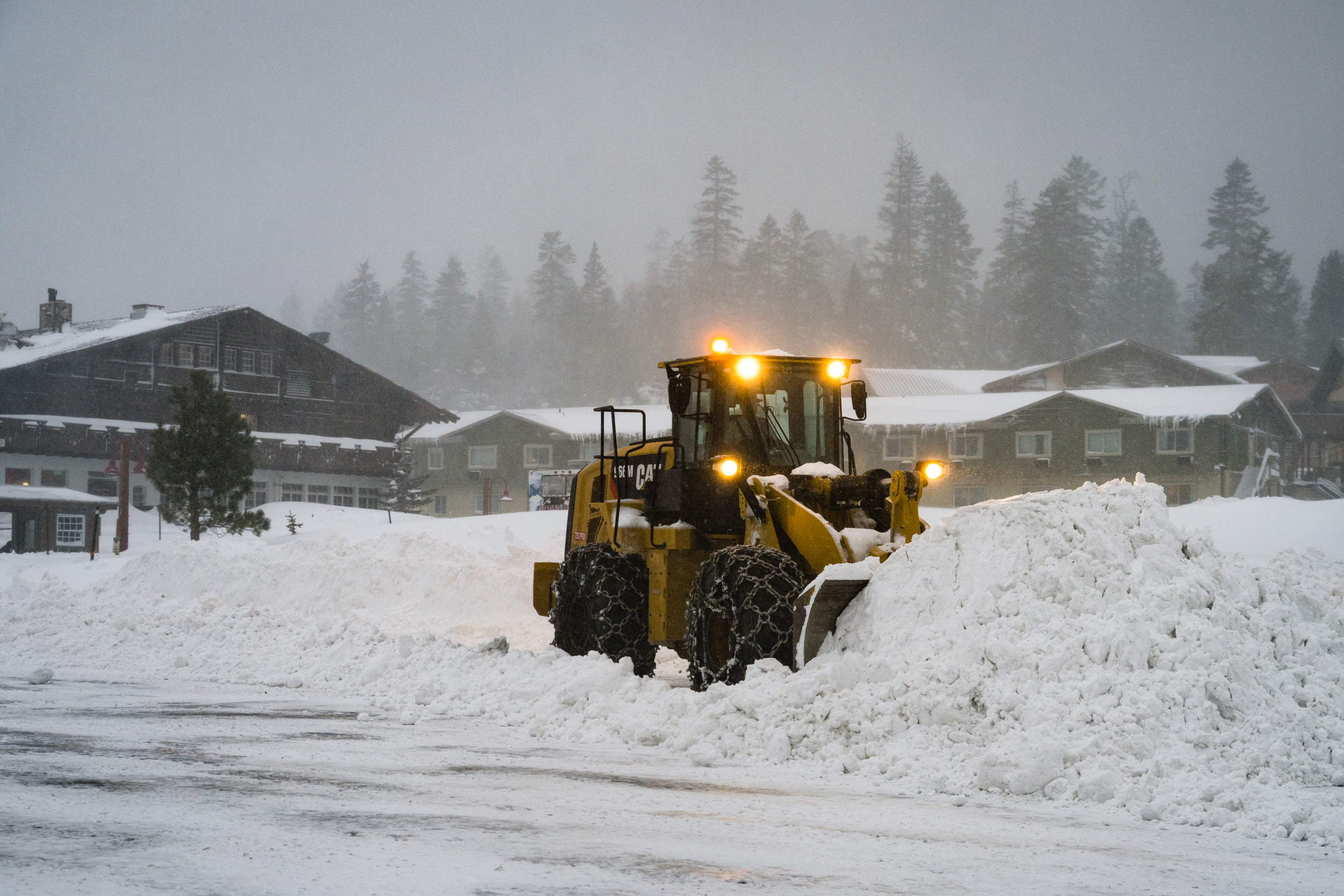 Snow is removed from the road as a major storm hit Mammoth on Dec. 23, 2021. (Courtesy of MMSA, Christian Pondella)