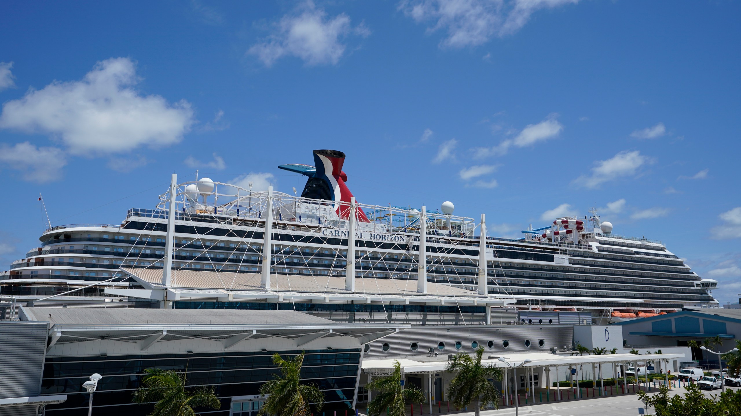 Carnival Cruise Line's Carnival Horizon cruise ship is shown docked at PortMiami, Friday, April 9, 2021, in Miami. The U.S. Centers for Disease Control and Prevention is investigating more cruise ships due to new COVID-19 cases aboard. The agency says 88 vessels are now either under investigation or observation, but it does not specify how many cases have been reported. (AP Photo/Wilfredo Lee)