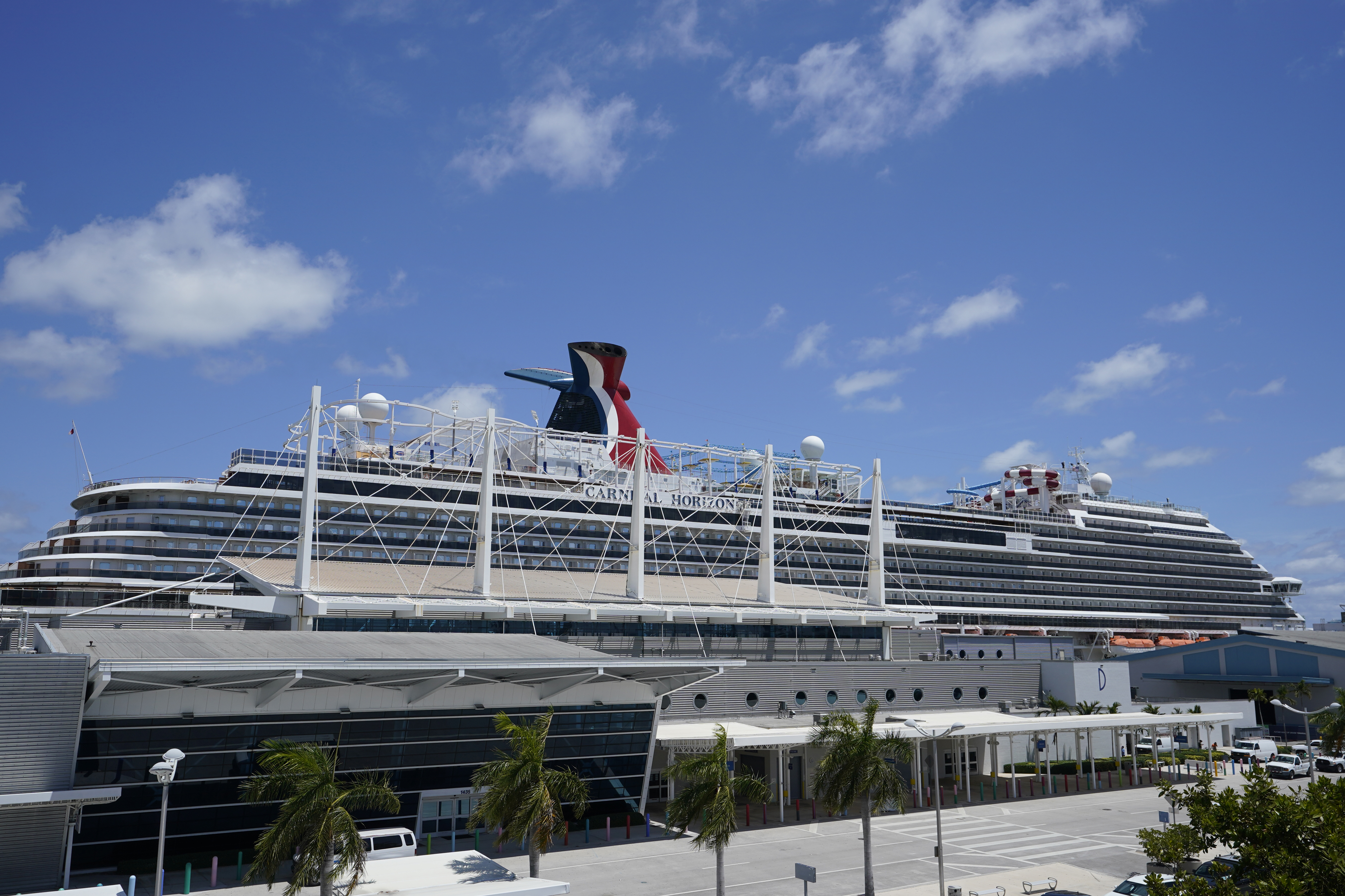 Carnival Cruise Line's Carnival Horizon cruise ship is shown docked at PortMiami, Friday, April 9, 2021, in Miami. The U.S. Centers for Disease Control and Prevention is investigating more cruise ships due to new COVID-19 cases aboard. The agency says 88 vessels are now either under investigation or observation, but it does not specify how many cases have been reported. (AP Photo/Wilfredo Lee)