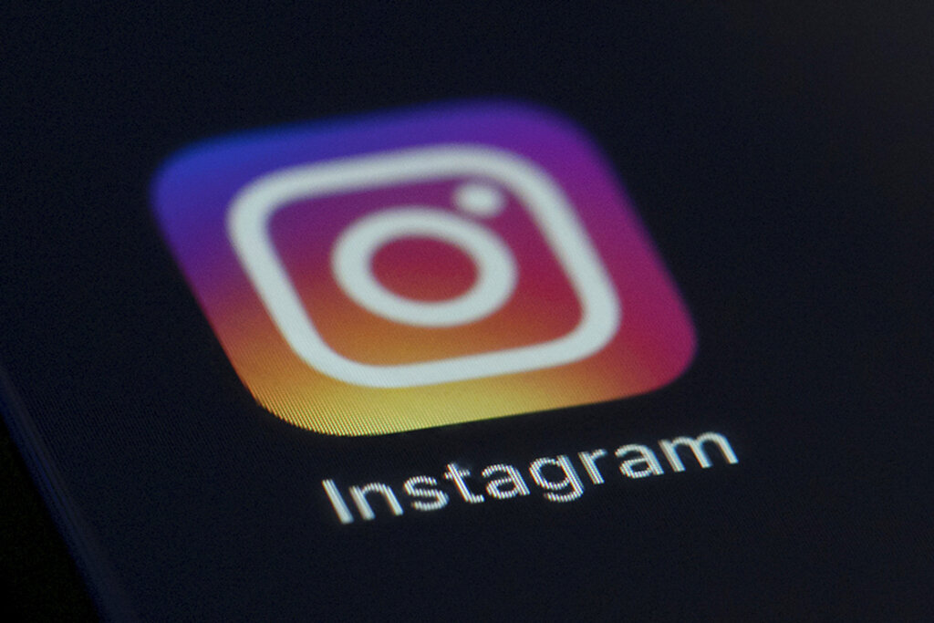 This Friday, Aug. 23, 2019 photo shows the Instagram app icon on the screen of a mobile device in New York. (AP Photo/Jenny Kane, File)