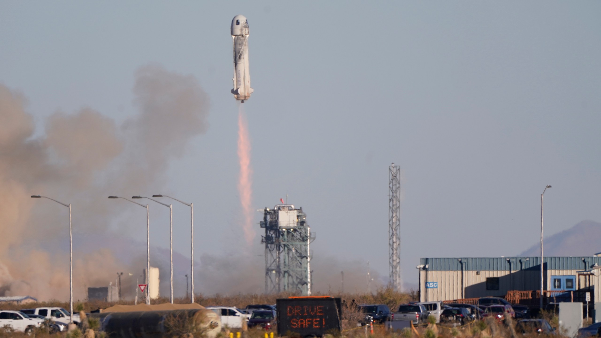 Blue Origin's New Shepard rocket launches carrying TV celebrity and former NFL football great Michael Strahan along with other passengers from its spaceport near Van Horn, Texas, Saturday, Dec. 11, 2021. Joining Strahan on the short space flight are Laura Shepard Churchley, the oldest daughter of America's first astronaut, Alan Shepard, as well as four paying customers. (AP Photo/LM Otero)