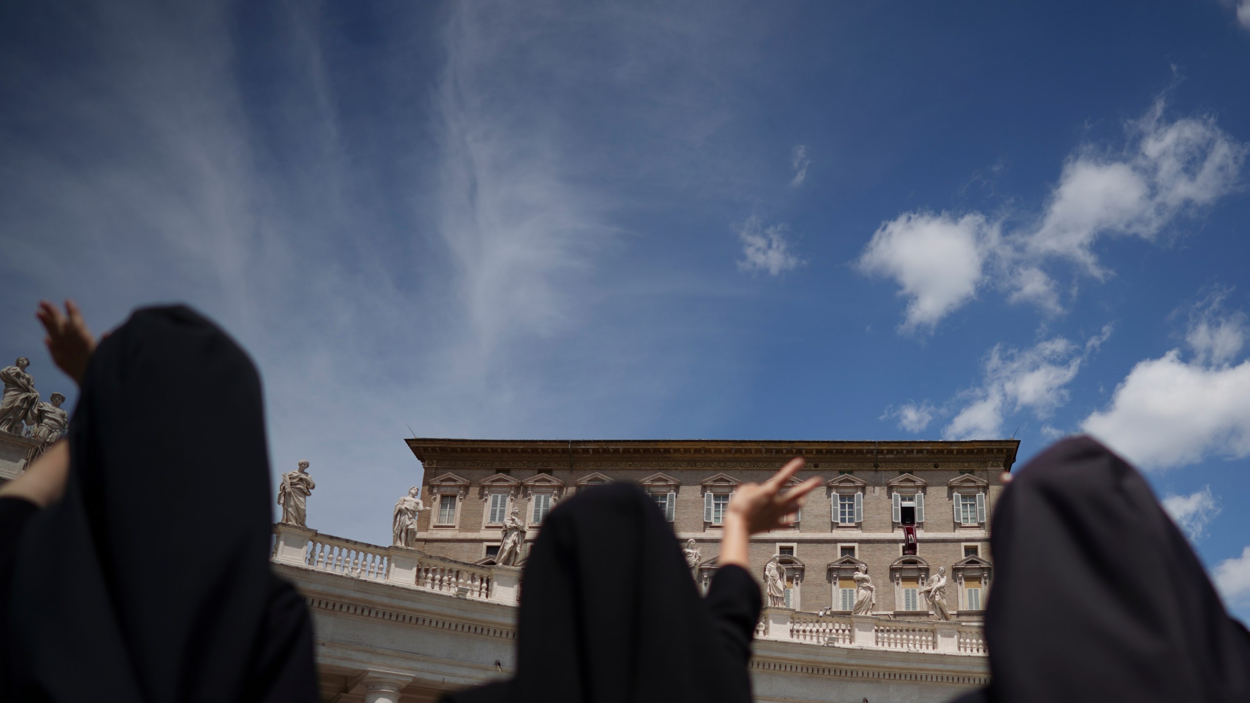 Nuns wave as Pope Francis delivers his blessing from the window of his studio overlooking St.Peter's Square, at the Vatican, on June 7, 2020. Pope Francis on Saturday, Dec. 11, 2021 drew attention to a taboo problem that the Vatican has long ignored or downplayed: the abuses of power by mother superiors against nuns who, because of their vows of obedience, have little recourse but to obey. (AP Photo/Andrew Medichini)